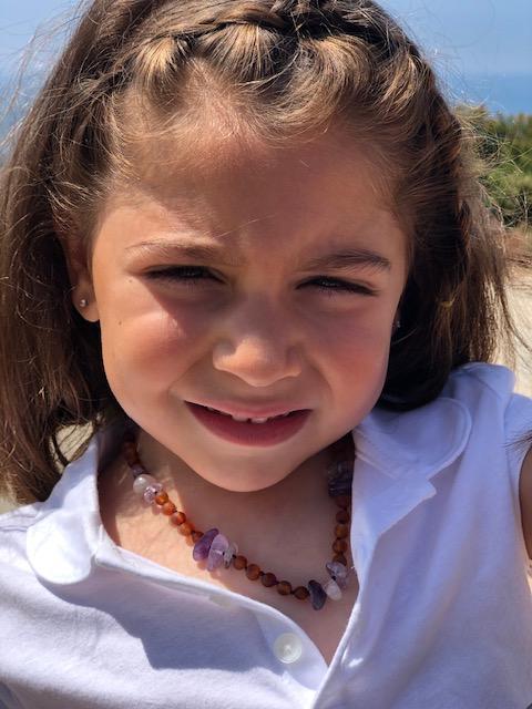 Cognac Amber + Amethyst Kids necklace featuring purple hues and individually knotted beads for safety, designed for children aged 4-15.