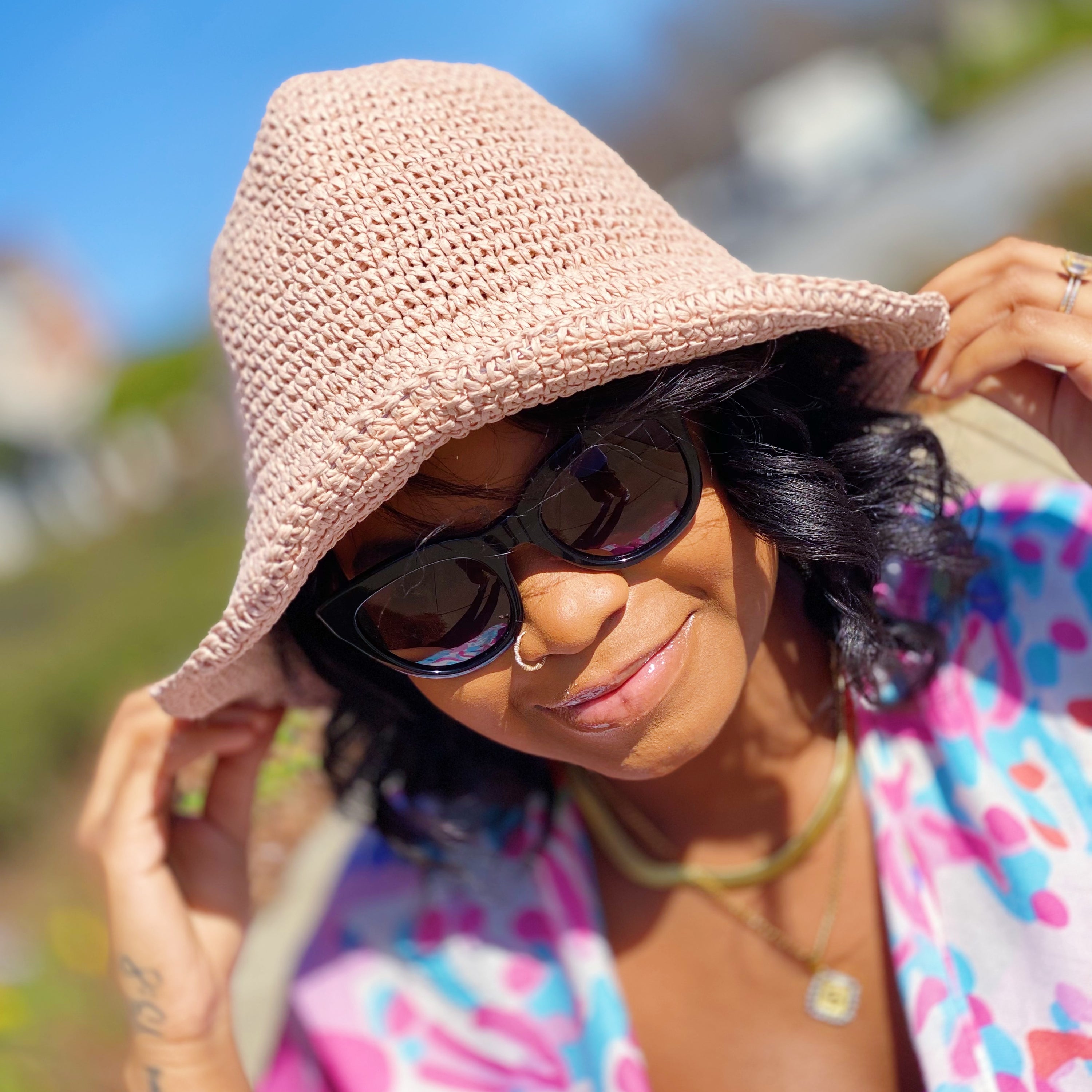 Collapsible Summer Bucket Hat made of straw with a moldable wire brim, perfect for summer outings and travel.