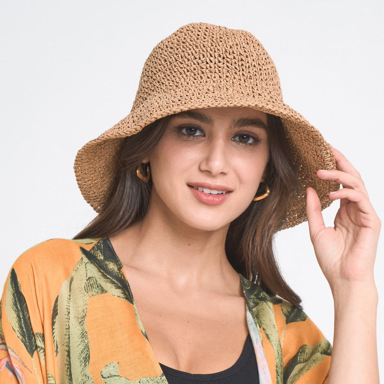 Collapsible Summer Bucket Hat made of straw with a moldable wire brim, perfect for summer outings and travel.