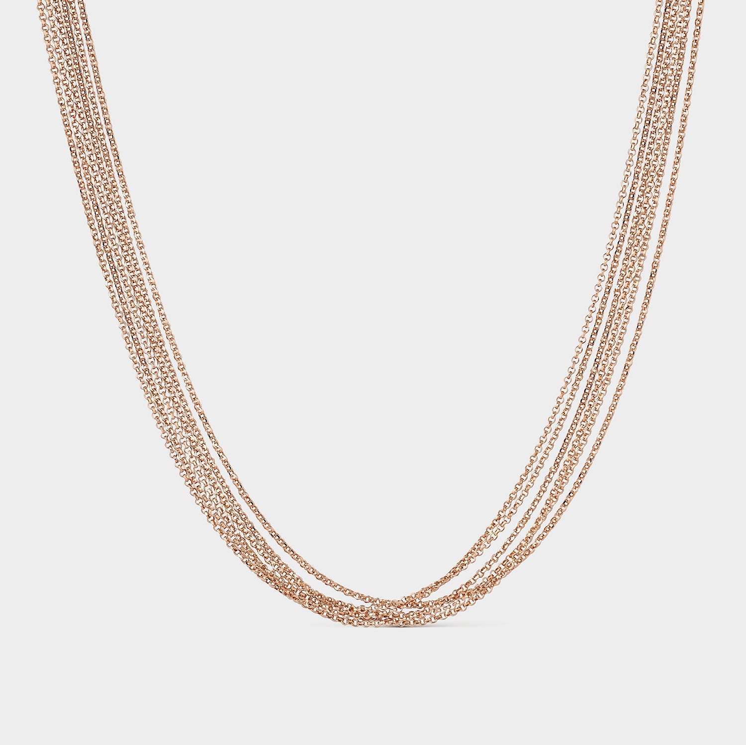 Collar de seis cadenas de plata con baño de oro rosa, elegante y versátil, ideal para cualquier ocasión.