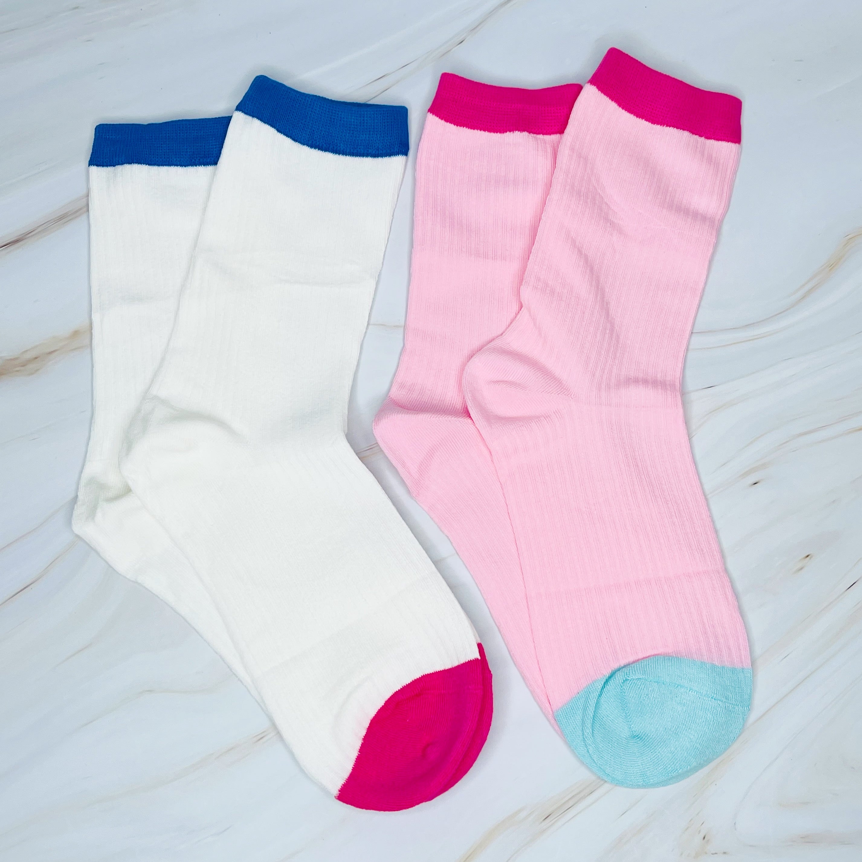 A stylish set of two color block socks featuring vibrant colors and a soft, silky texture, perfect for everyday wear.