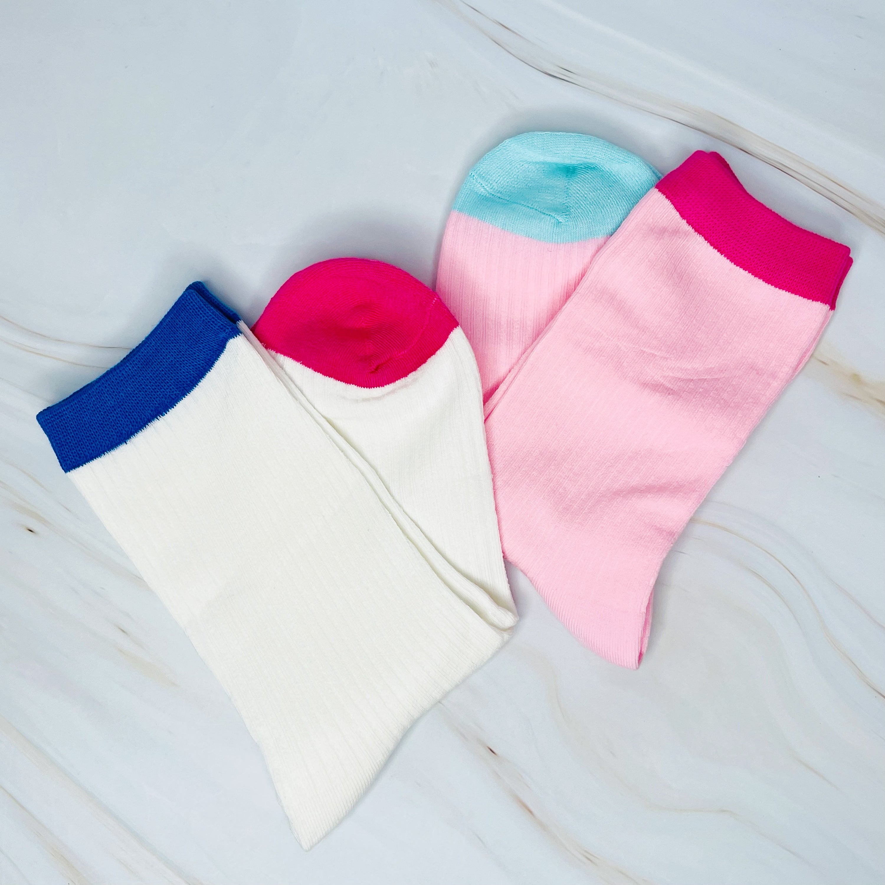 A stylish set of two color block socks featuring vibrant colors and a soft, silky texture, perfect for everyday wear.