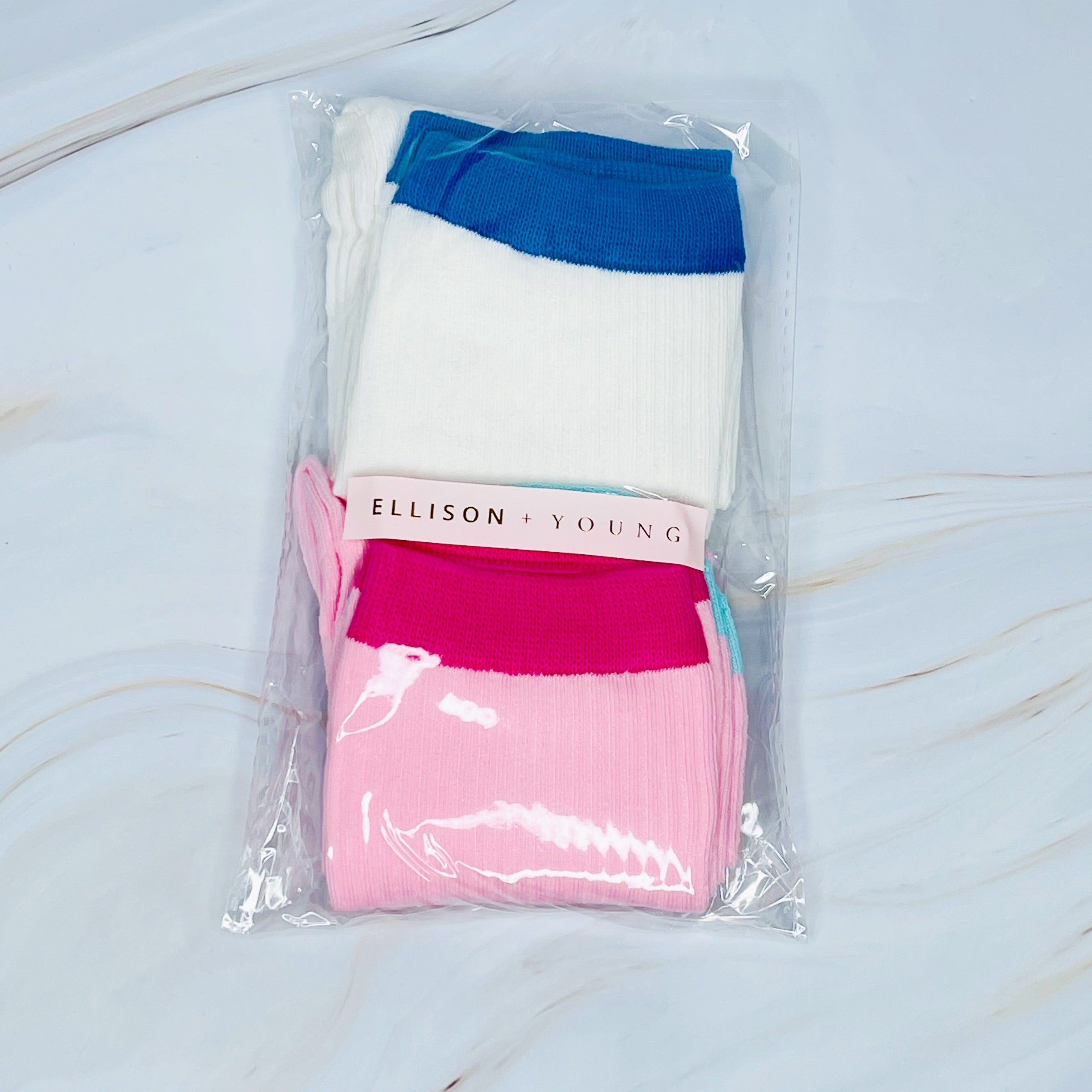 A stylish set of two color block socks featuring vibrant colors and a soft, silky texture, perfect for everyday wear.