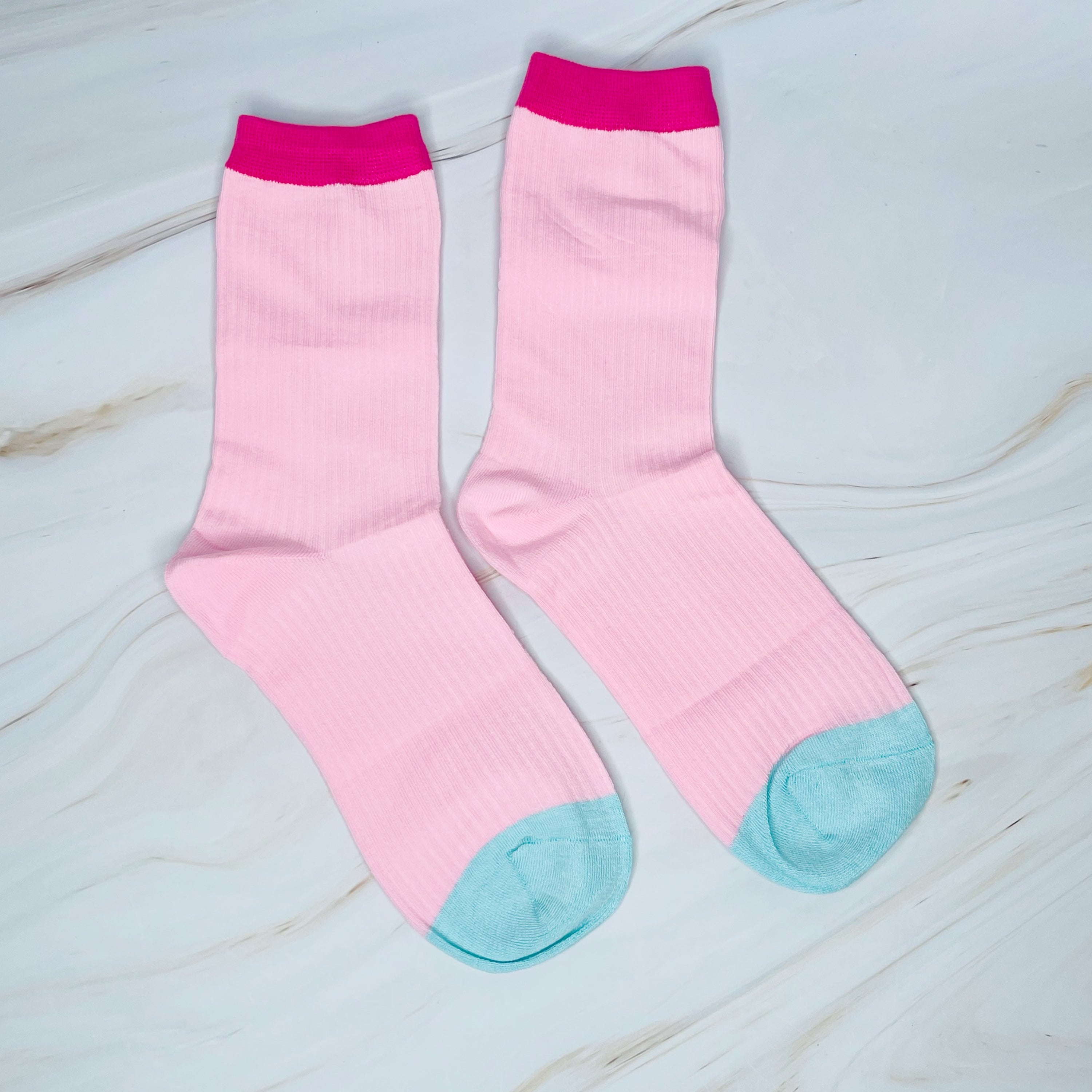 A stylish set of two color block socks featuring vibrant colors and a soft, silky texture, perfect for everyday wear.