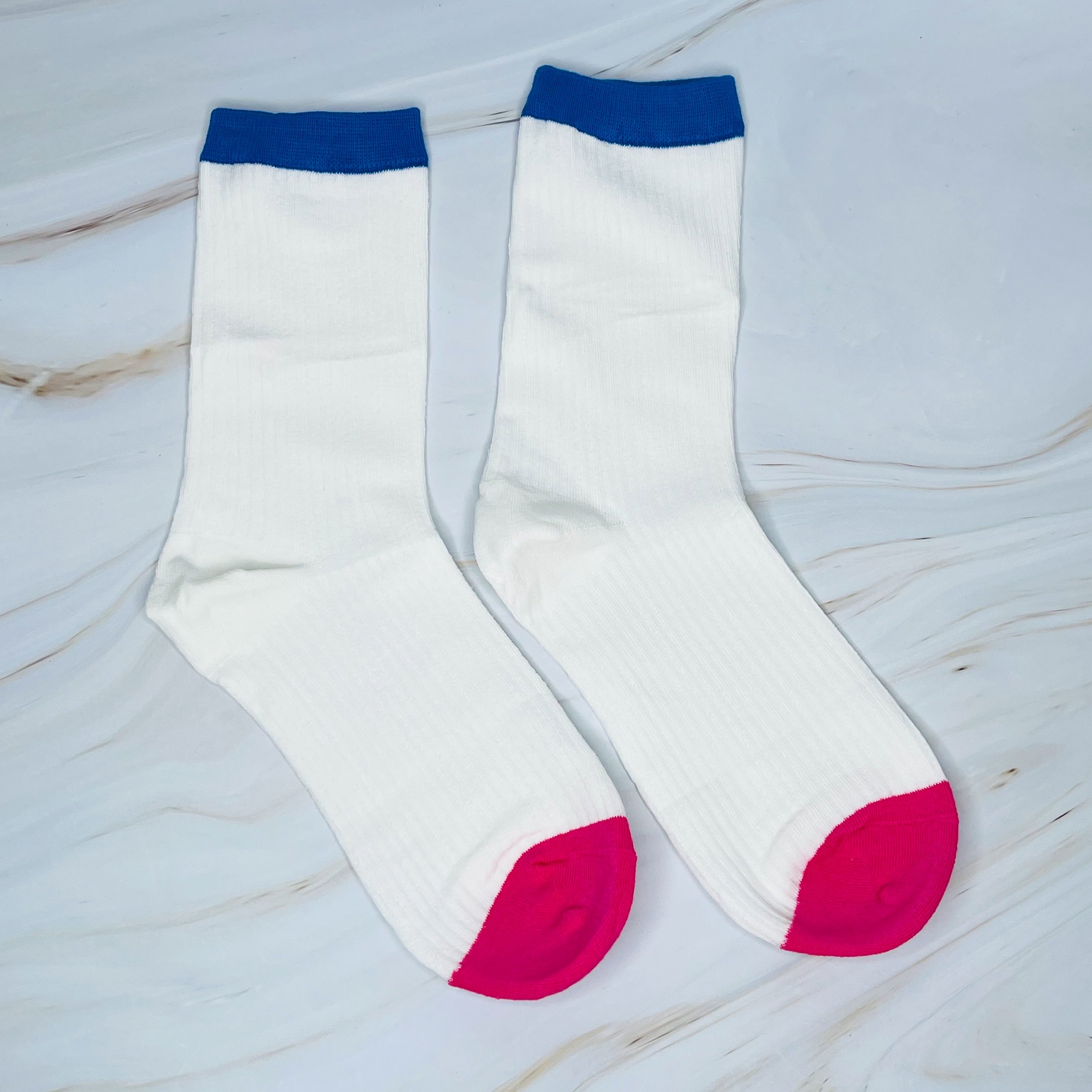 A stylish set of two color block socks featuring vibrant colors and a soft, silky texture, perfect for everyday wear.