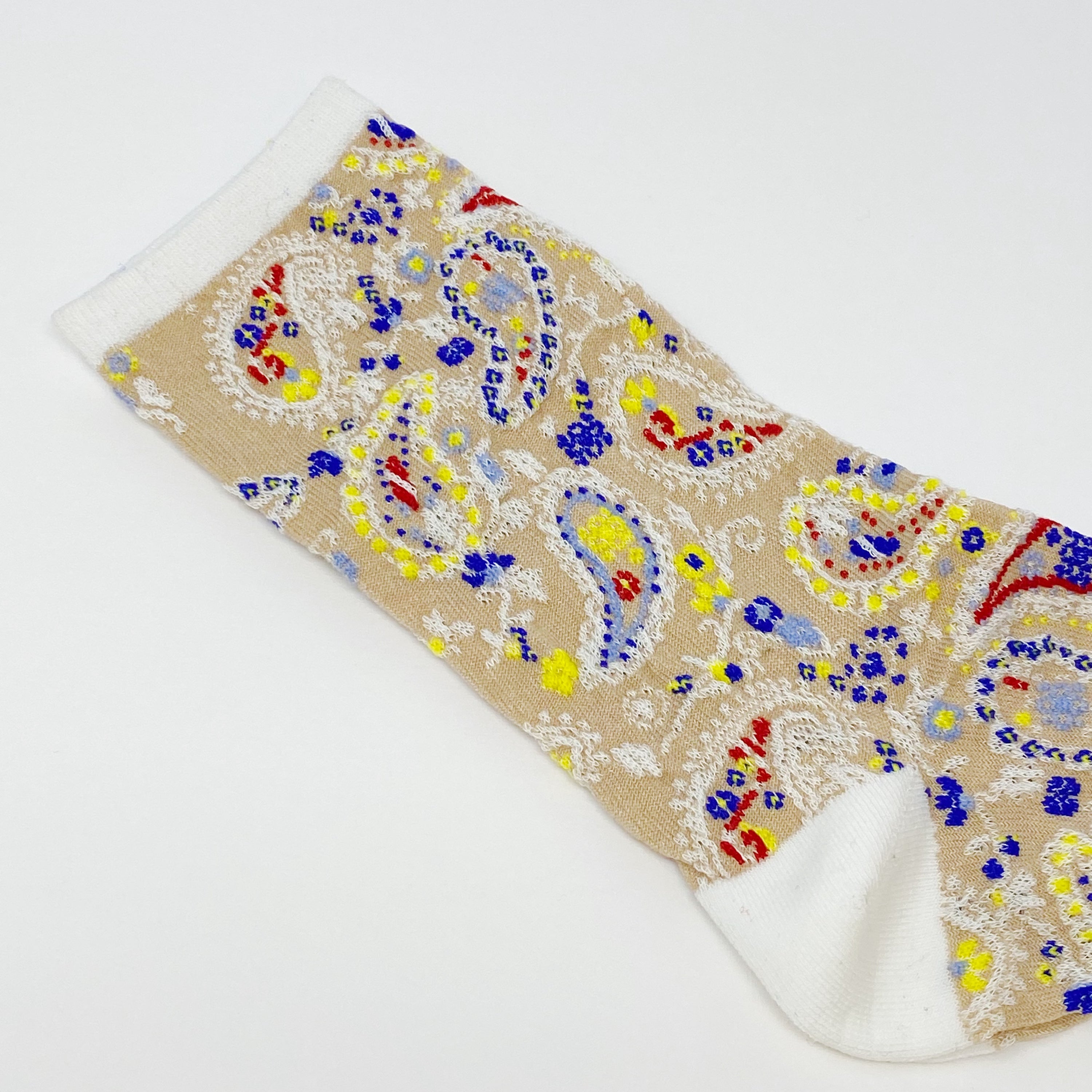 Color Heaven Paisley Socks Set featuring two pairs of stylish socks with vibrant paisley patterns, packaged in a clear cello bag.