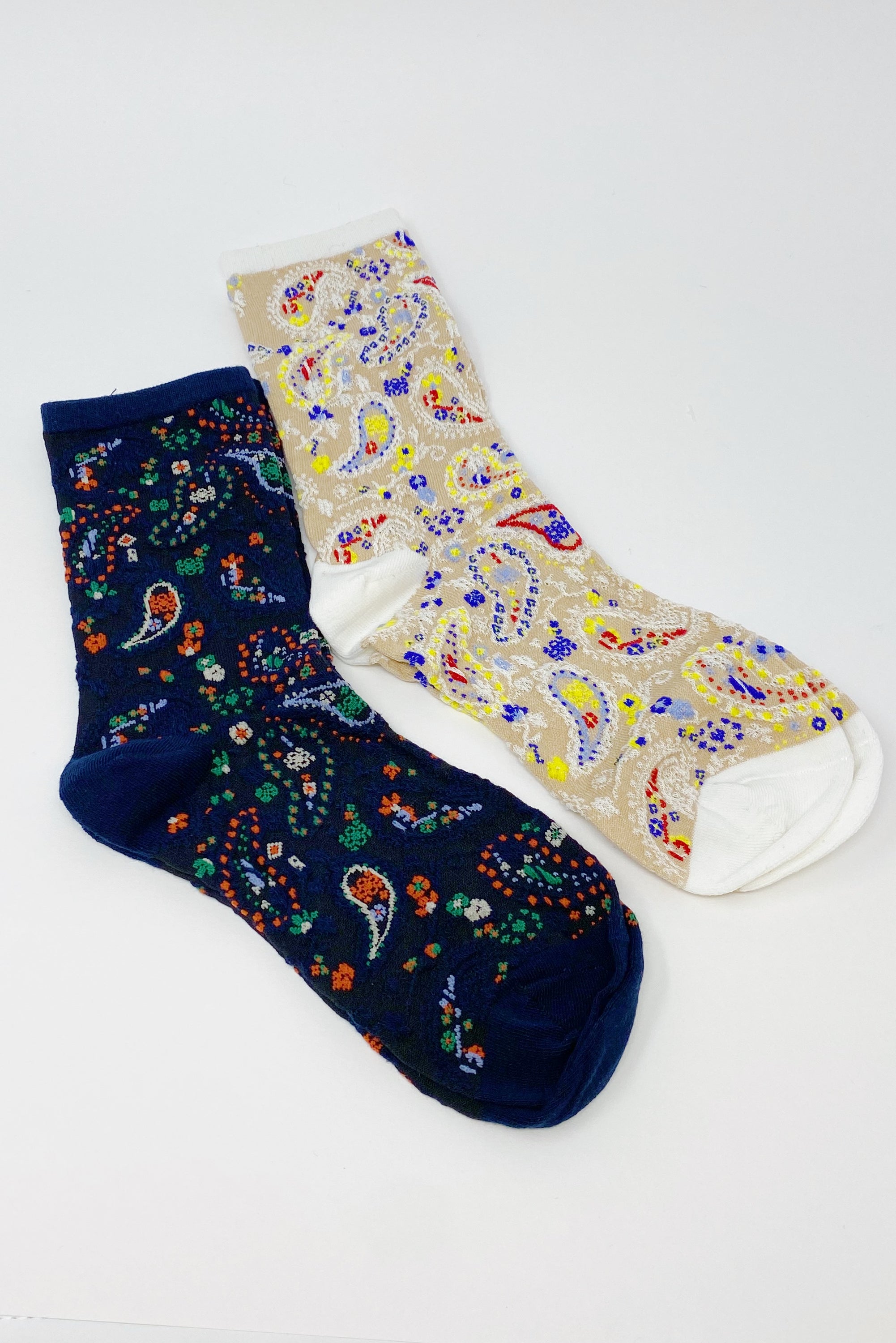 Color Heaven Paisley Socks Set featuring two pairs of stylish socks with vibrant paisley patterns, packaged in a clear cello bag.