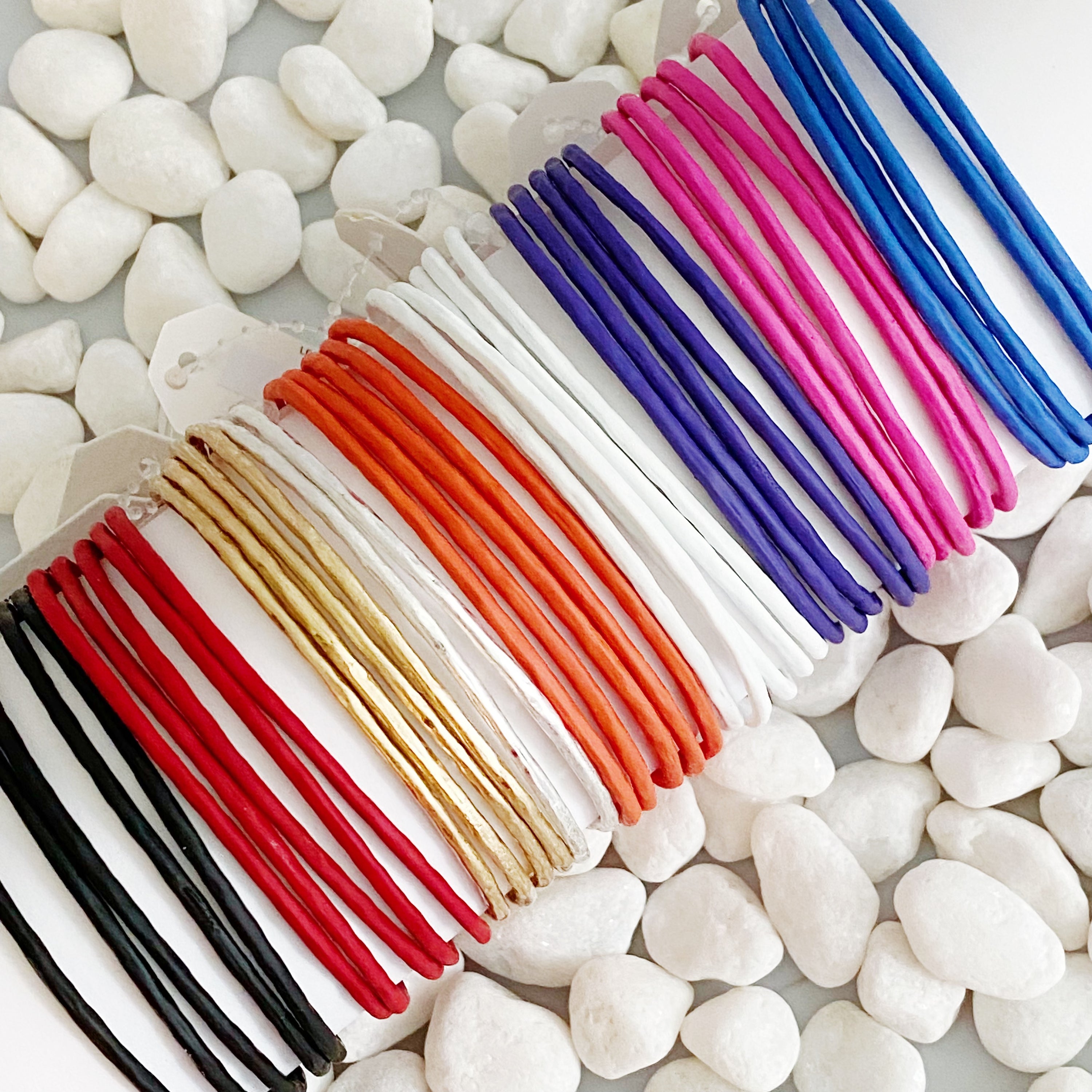 Color Of Your Game Slim Bangle Set of 5 in vibrant colors with a matt rubber finish, showcasing a stylish and modern design.