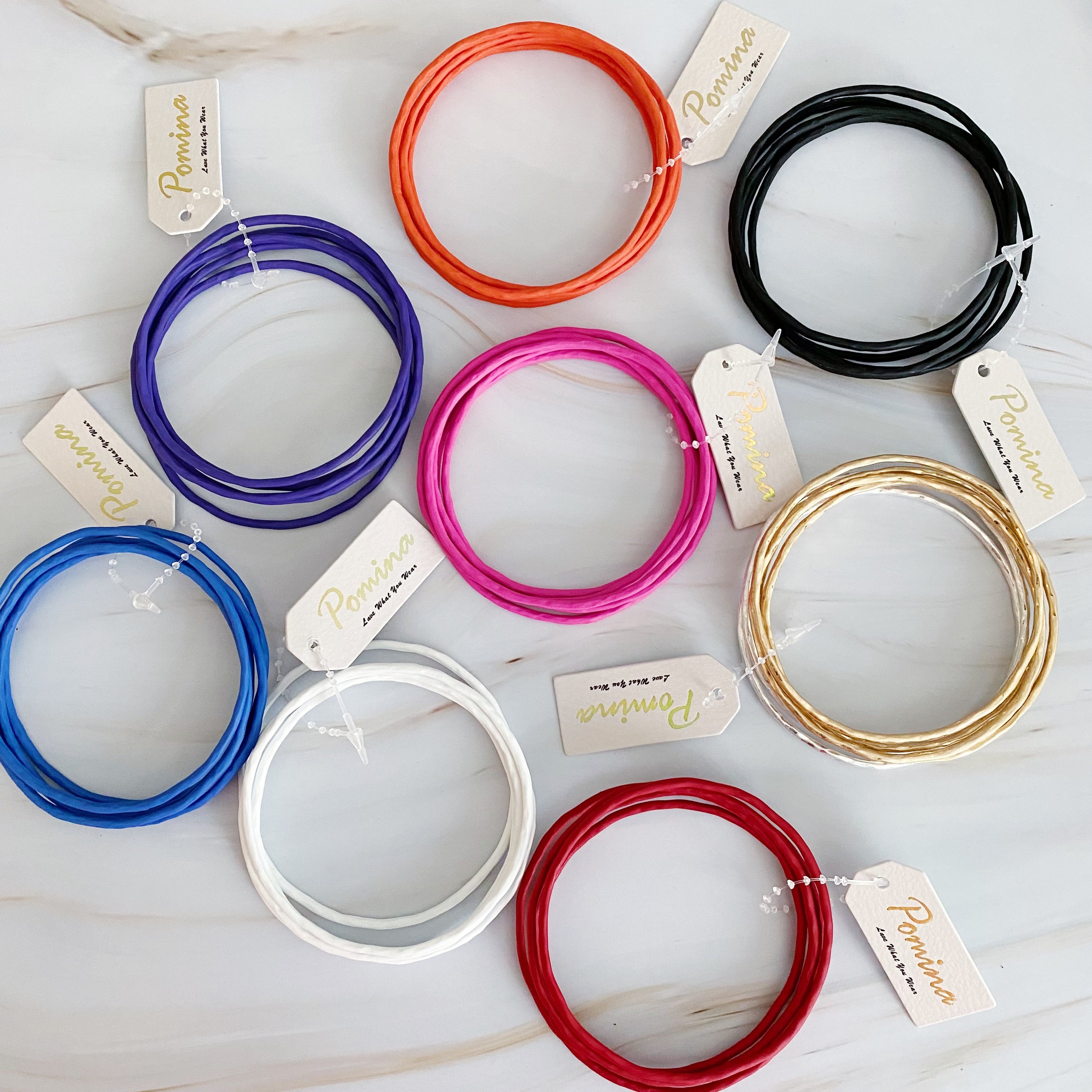 Color Of Your Game Slim Bangle Set of 5 in vibrant colors with a matt rubber finish, showcasing a stylish and modern design.