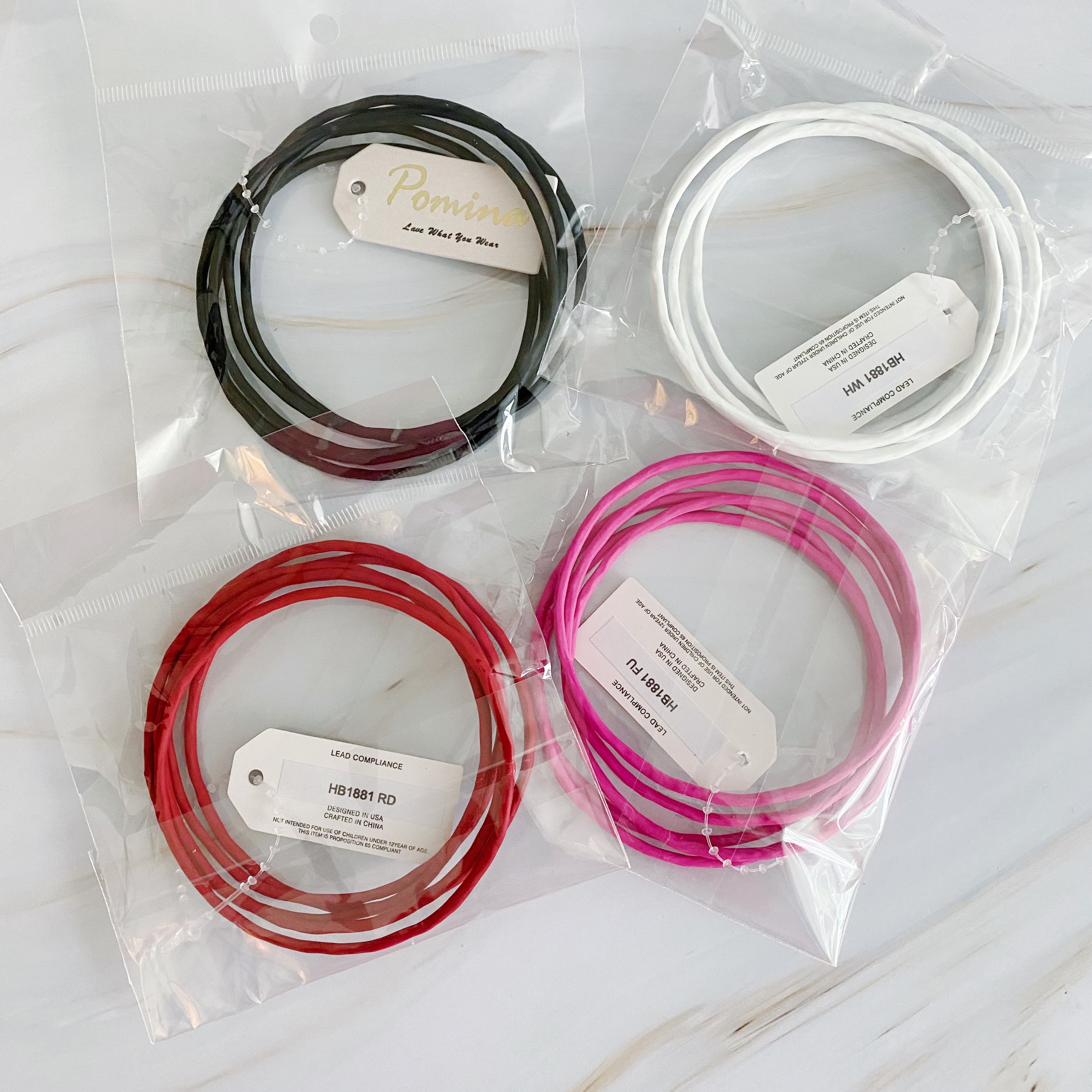 Color Of Your Game Slim Bangle Set of 5 in vibrant colors with a matt rubber finish, showcasing a stylish and modern design.