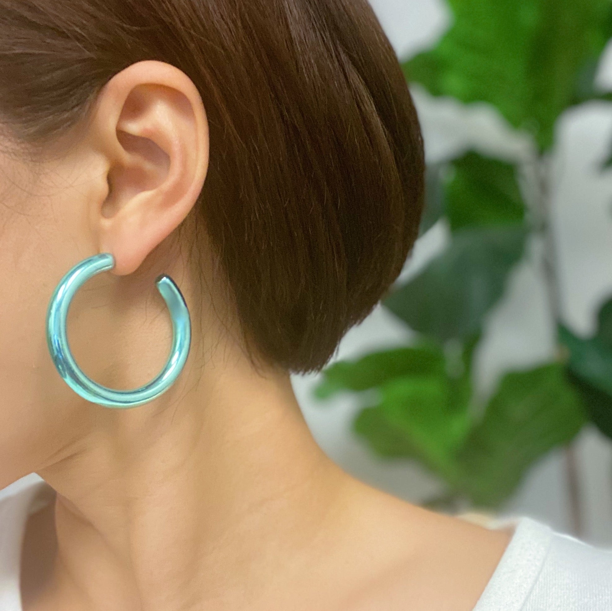 A pair of colorful metallic finish tube hoop earrings, showcasing vibrant hues and a lightweight design, perfect for everyday wear.