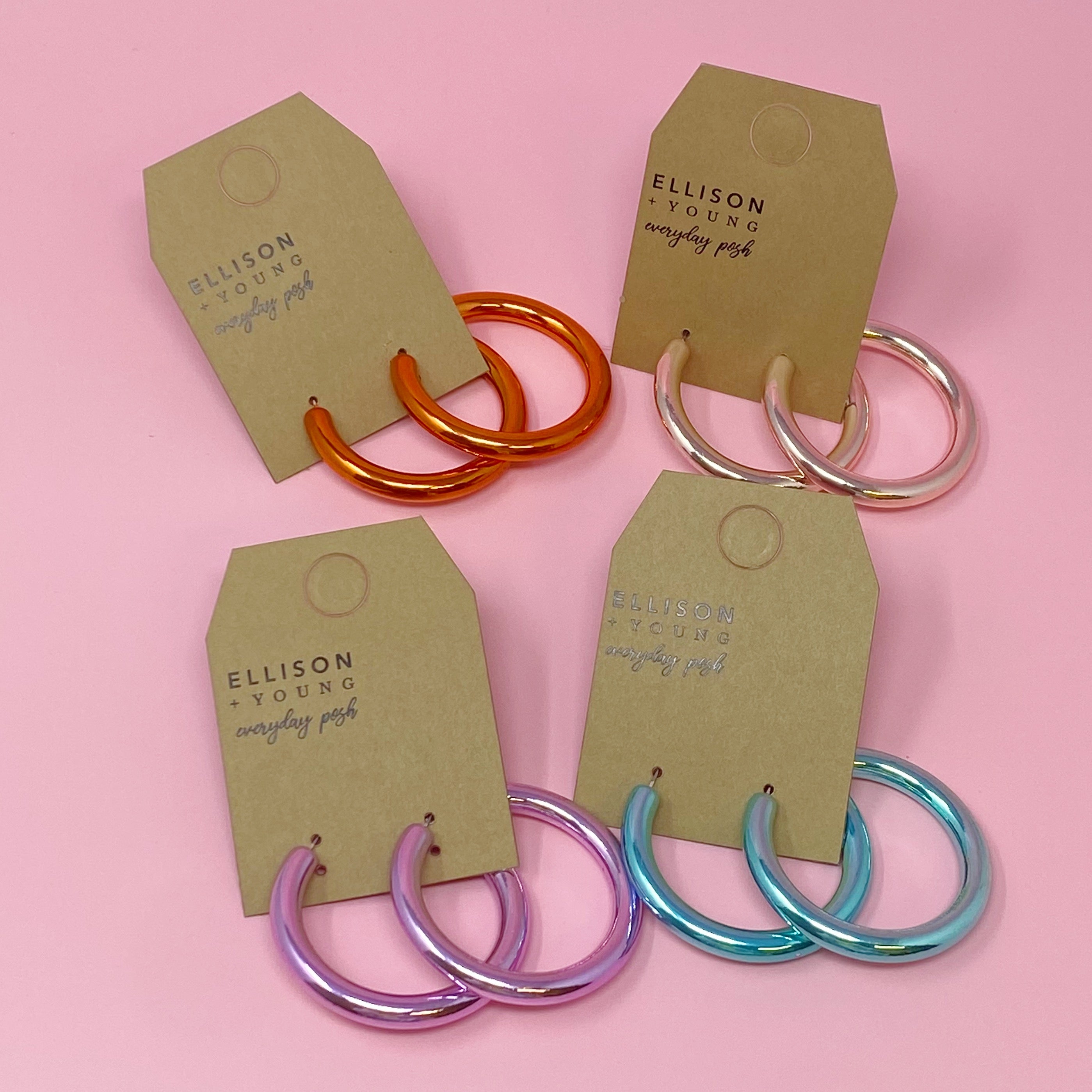 A pair of colorful metallic finish tube hoop earrings, showcasing vibrant hues and a lightweight design, perfect for everyday wear.