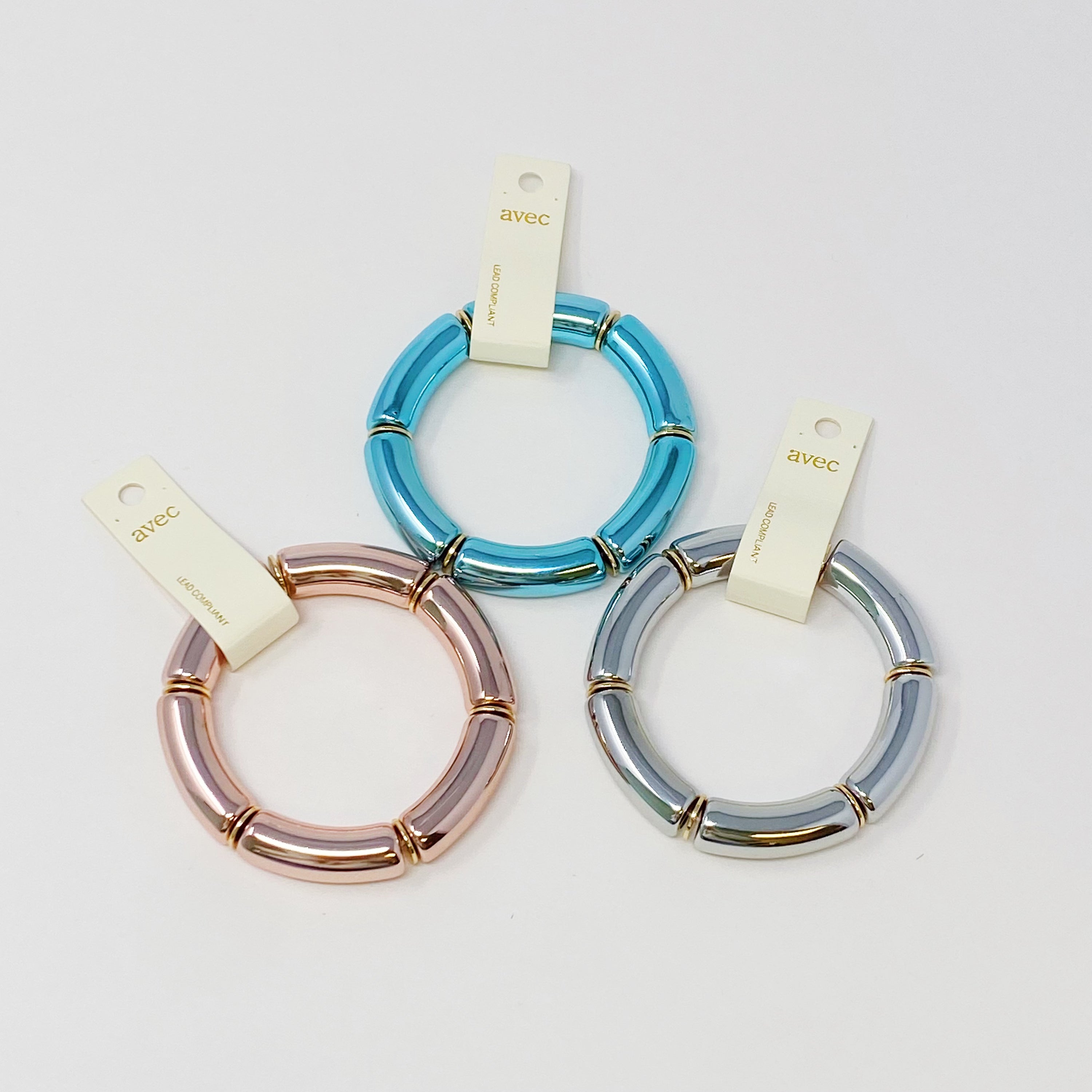 A colorful tube stretch bracelet made of gold plated brass, featuring vibrant tubes in a lightweight design.