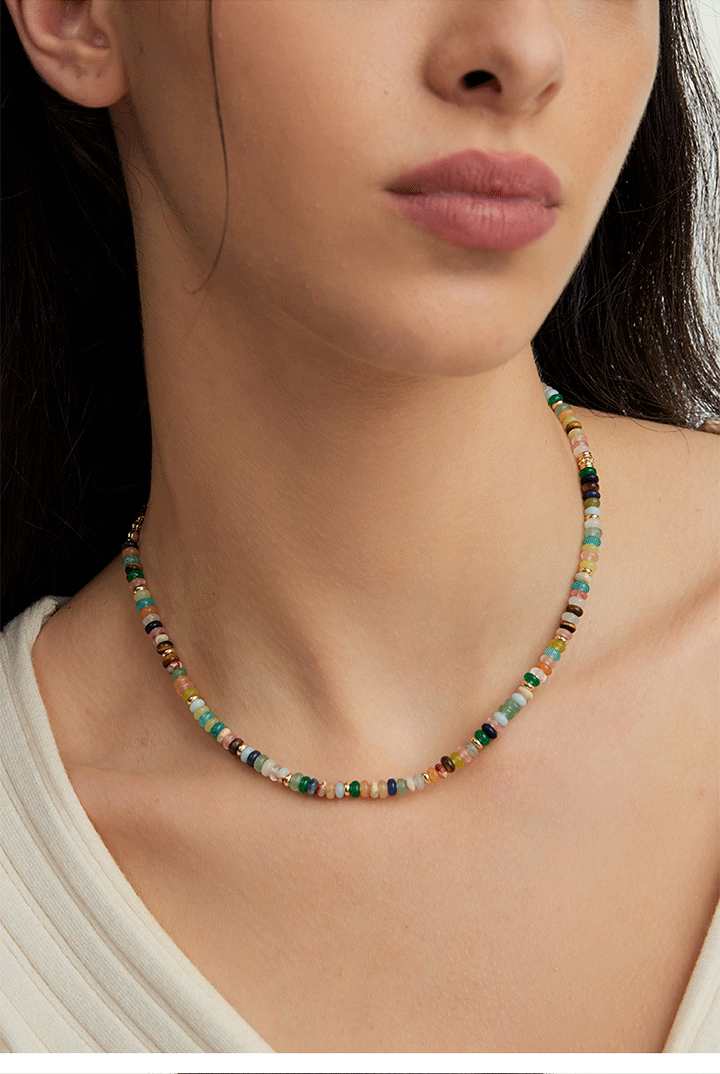 A vibrant mint mambo beaded necklace with playful colors, designed to uplift and energize any outfit.