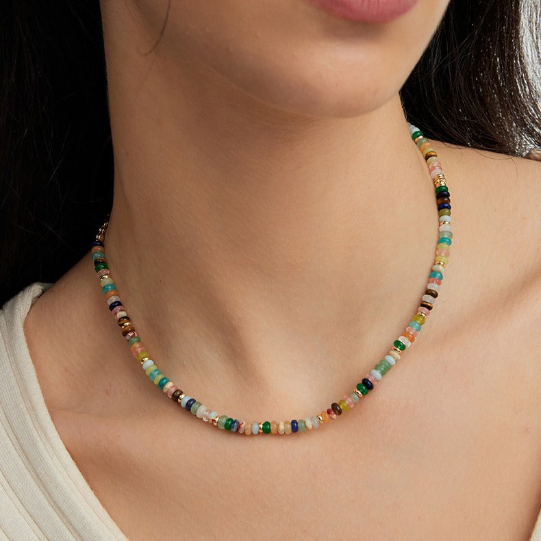 A vibrant mint mambo beaded necklace with playful colors, designed to uplift and energize any outfit.