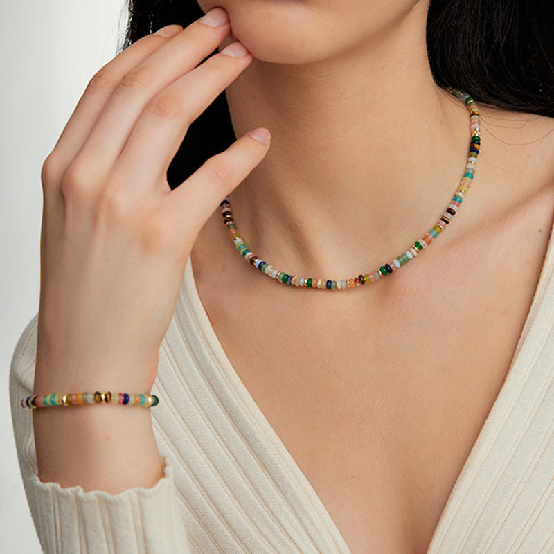 A vibrant mint mambo beaded necklace with playful colors, designed to uplift and energize any outfit.