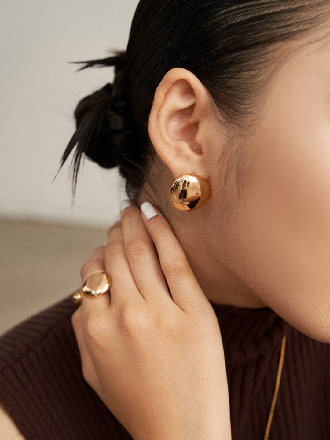 Concave and Convex Style Asymmetrical Stud Earrings in sterling silver with gold vermeil finish, showcasing unique design and elegant craftsmanship.