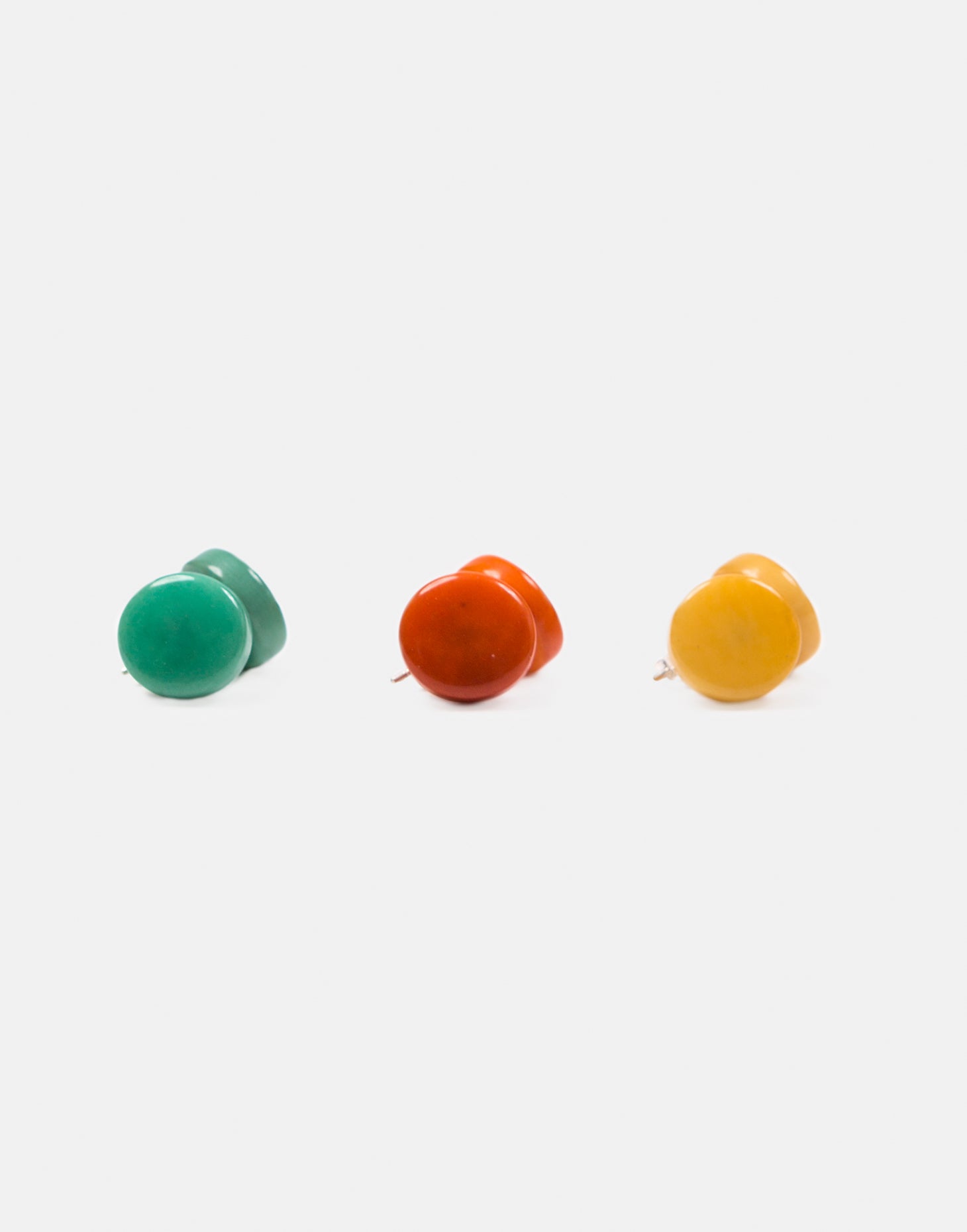 Confetti Tagua Stud Trio Set featuring colorful hand-cut tagua nut earrings with sterling silver findings, displayed in eco-friendly packaging.