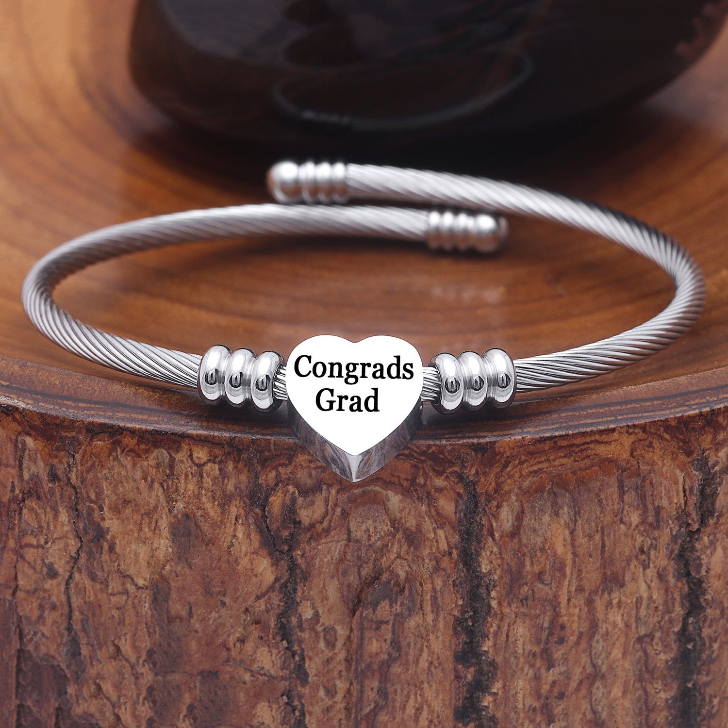 Silver stainless steel heart charm bangle for graduation gifts, adjustable and lead-free.