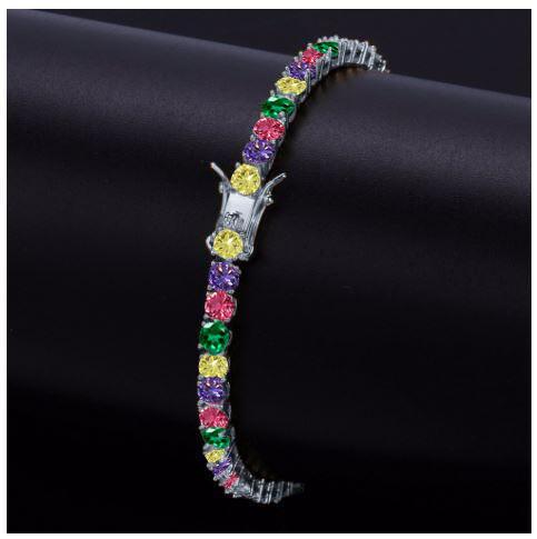 CONOID 4MM CZ Bracelet featuring sparkling cubic zirconia stones set in a brass chain, elegantly designed for a luxurious look.