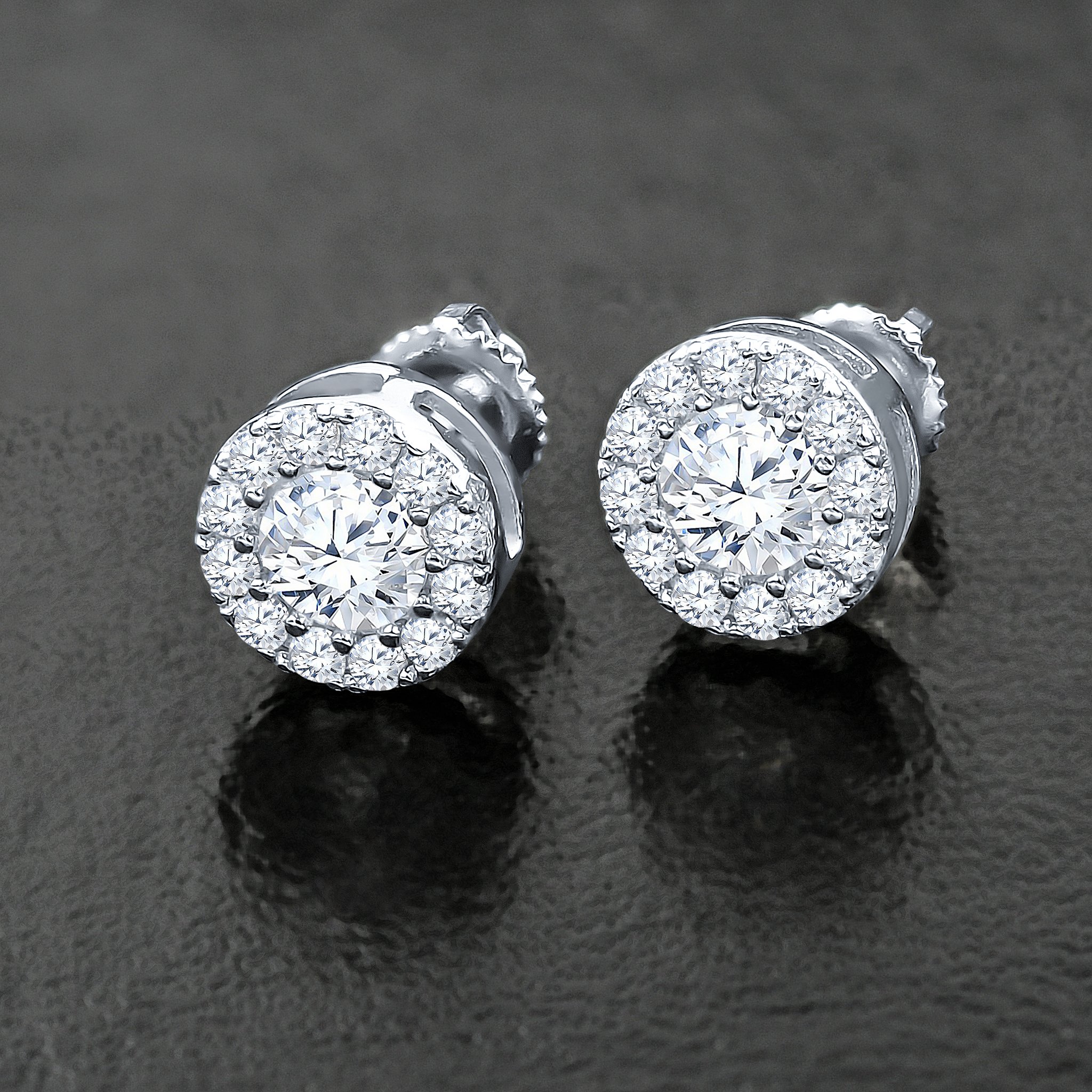 A pair of CONSPICUOUS Screw Back Earrings featuring sparkling Cubic Zircon stones set in 925 Sterling Silver, showcasing their elegant design.