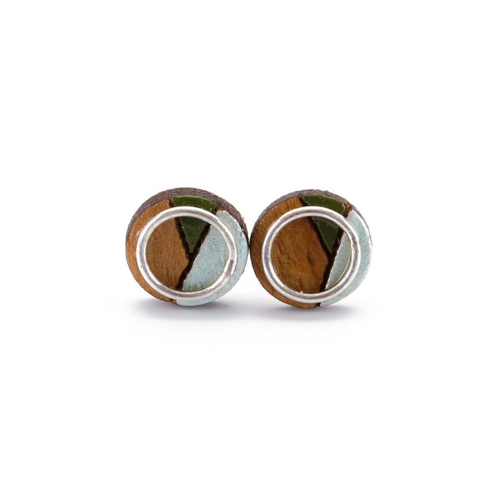 Conture Eco Luxury Wood Stud Earrings in four colors, handcrafted from recycled wood with sterling silver backing, showcasing unique natural patterns.