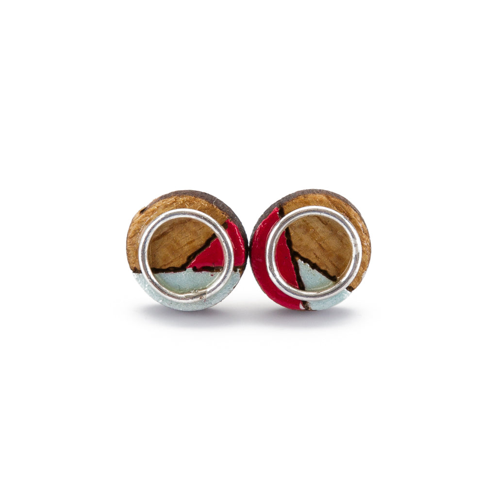 Conture Eco Luxury Wood Stud Earrings in four colors, handcrafted from recycled wood with sterling silver backing, showcasing unique natural patterns.