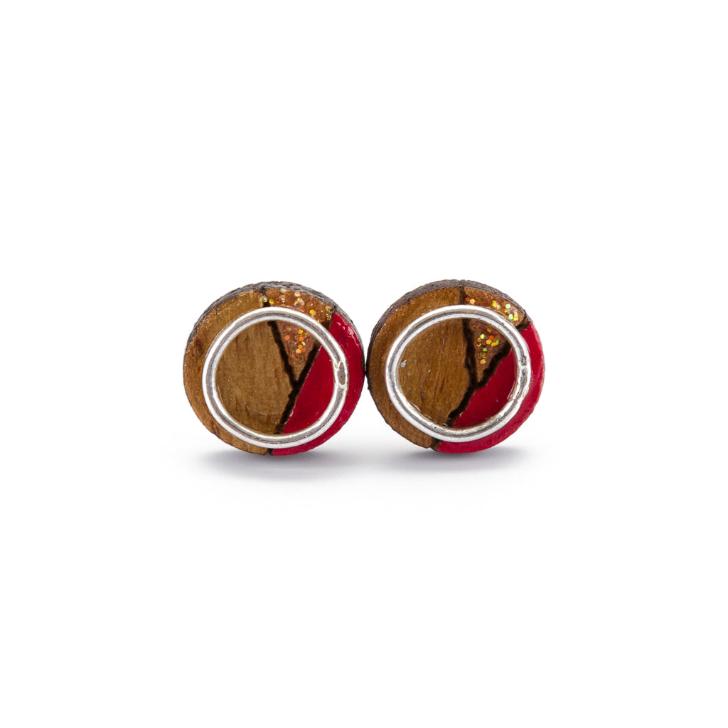 Conture Eco Luxury Wood Stud Earrings in four colors, handcrafted from recycled wood with sterling silver backing, showcasing unique natural patterns.