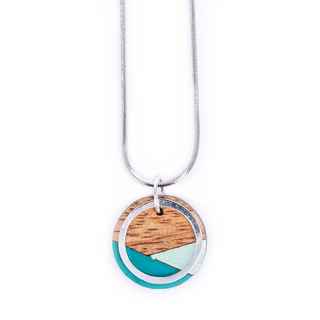 Conture Recycled Wood Silver Necklace showcasing vibrant colors and unique handcrafted design, featuring a silver titanium chain and brass ring.