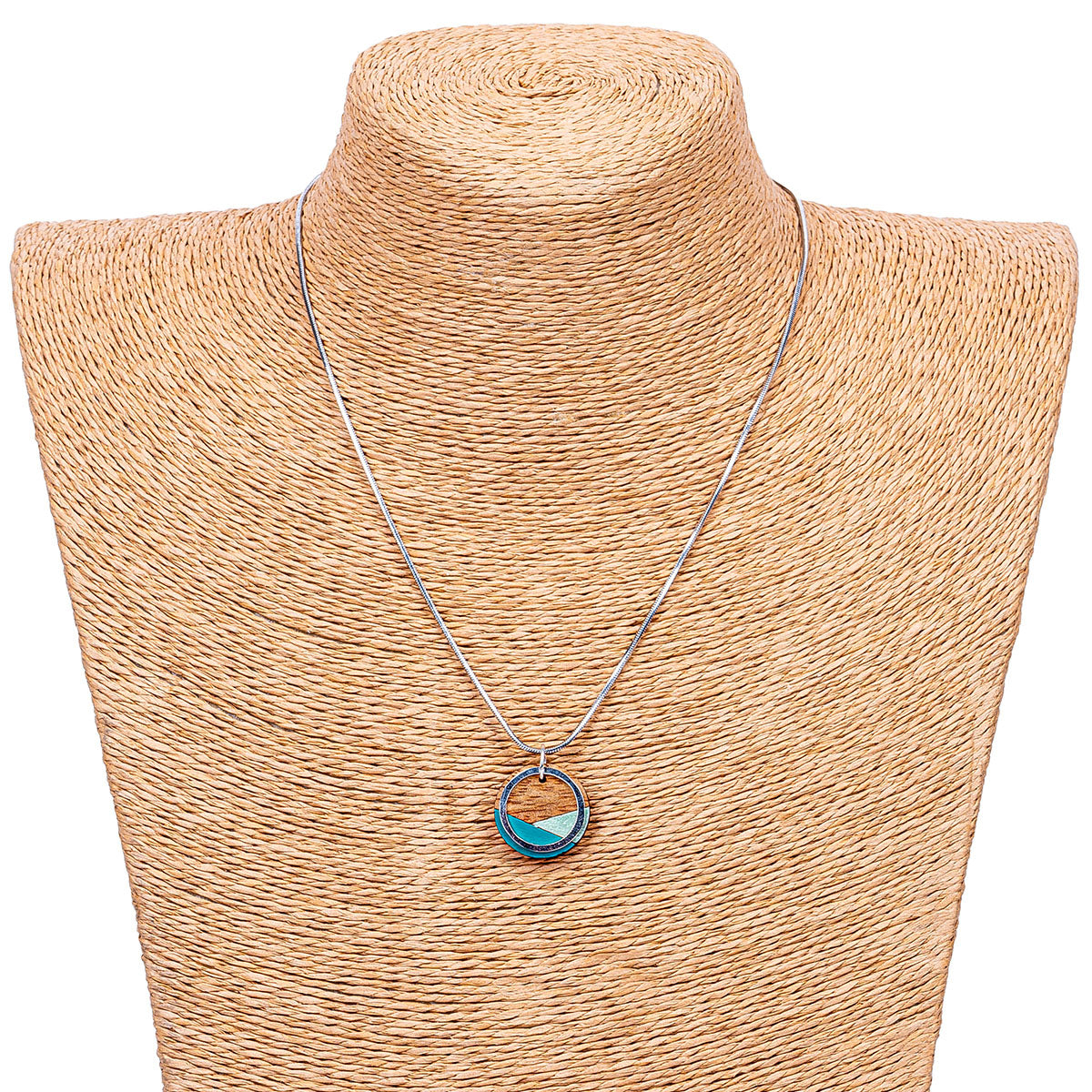 Conture Recycled Wood Silver Necklace showcasing vibrant colors and unique handcrafted design, featuring a silver titanium chain and brass ring.