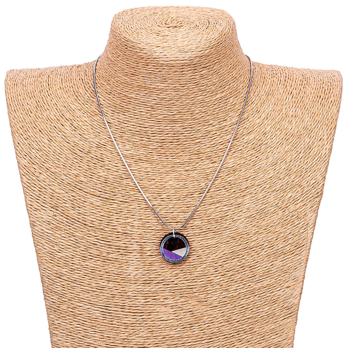 Conture Recycled Wood Silver Necklace showcasing vibrant colors and unique handcrafted design, featuring a silver titanium chain and brass ring.