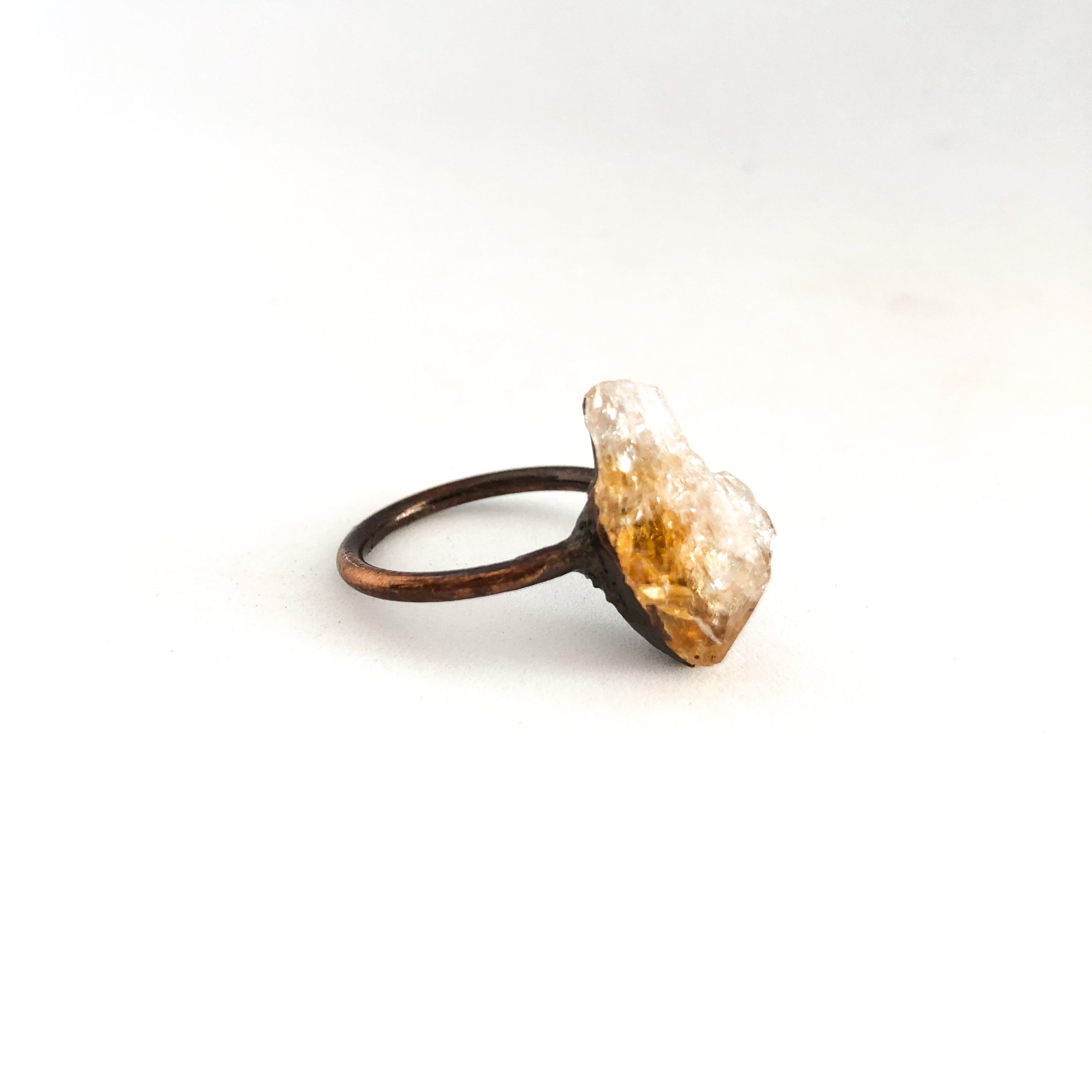 A beautiful Copper Gemstone Ring featuring citrine, amethyst, and rose quartz, showcasing its therapeutic properties and elegant design.