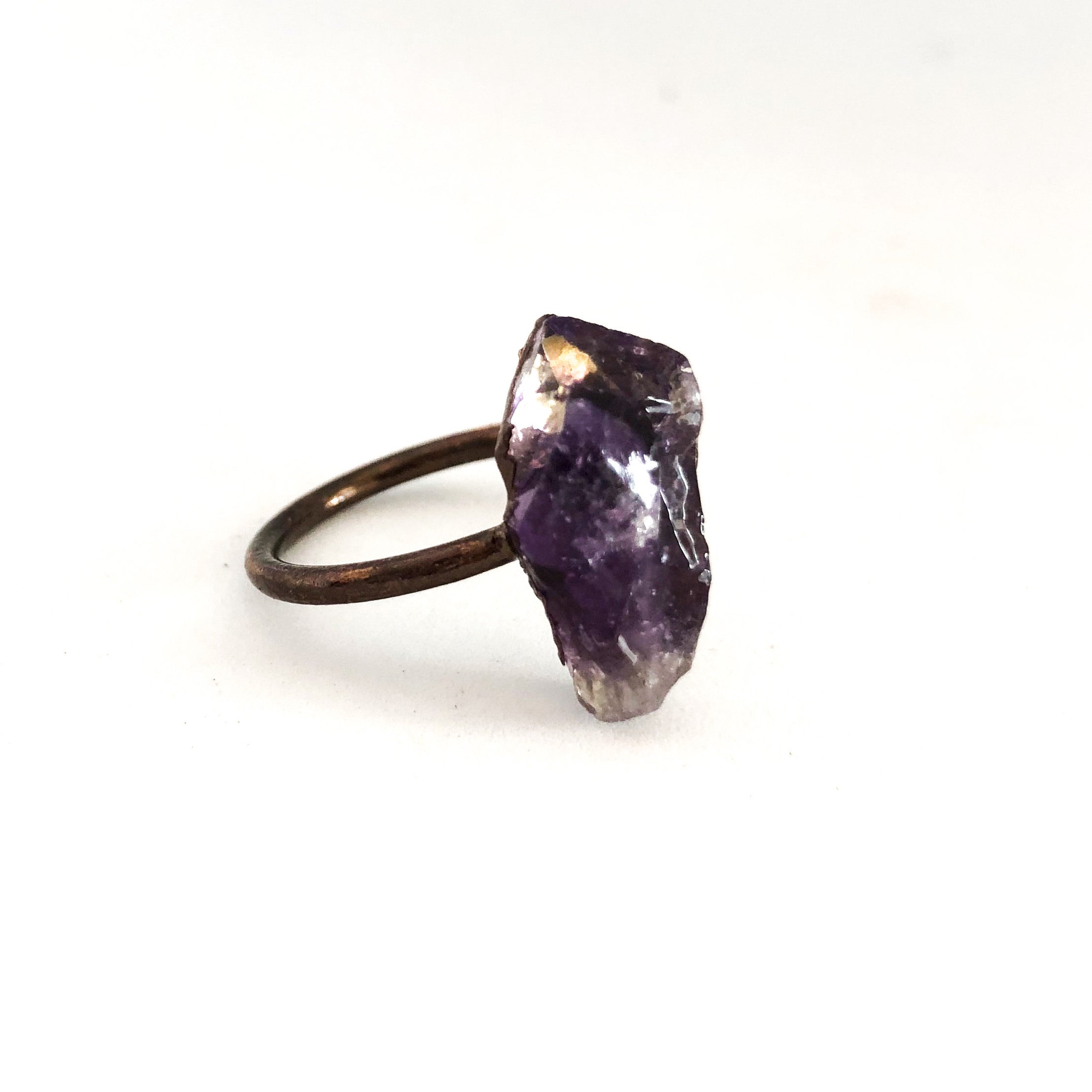 A beautiful Copper Gemstone Ring featuring citrine, amethyst, and rose quartz, showcasing its therapeutic properties and elegant design.