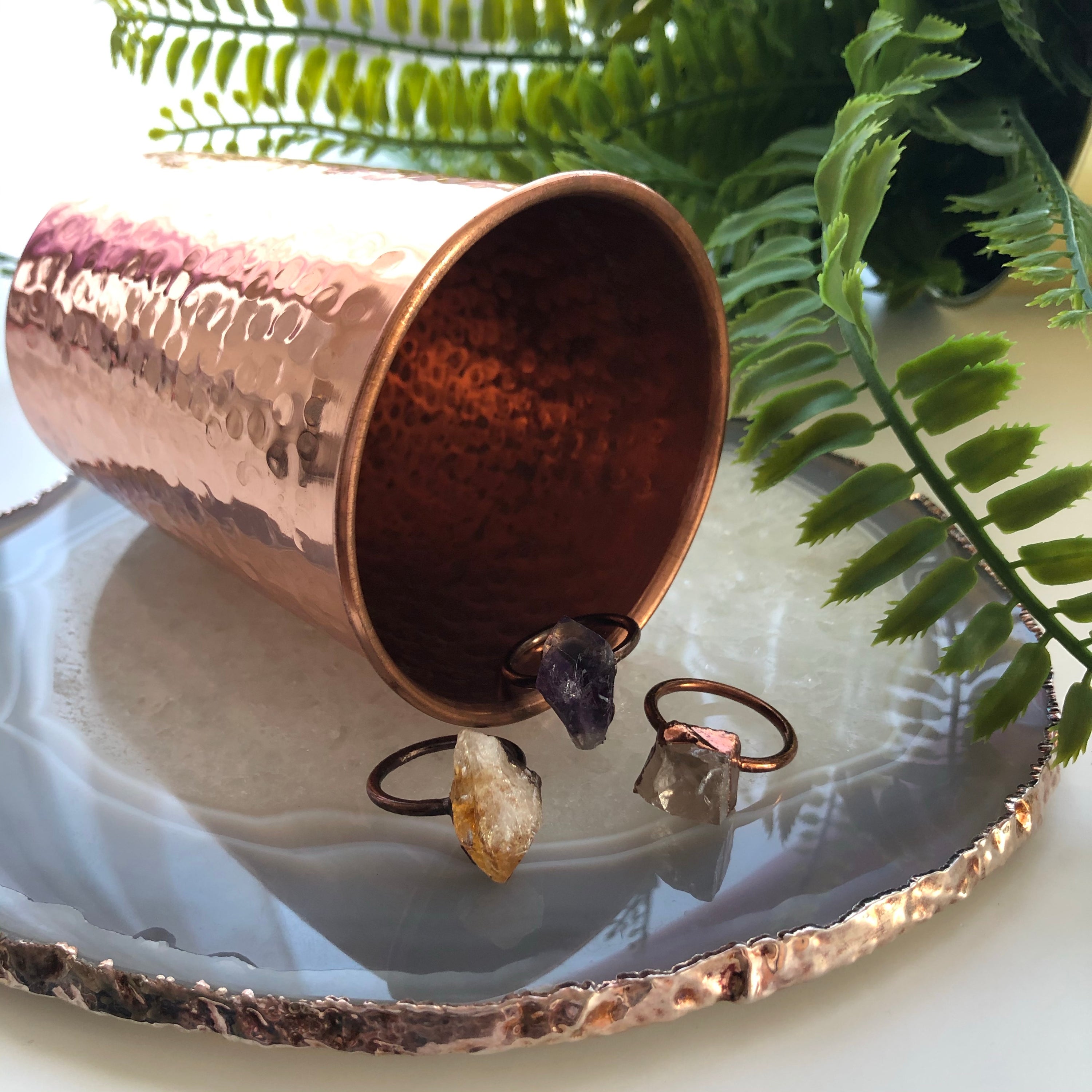 A beautiful Copper Gemstone Ring featuring citrine, amethyst, and rose quartz, showcasing its therapeutic properties and elegant design.