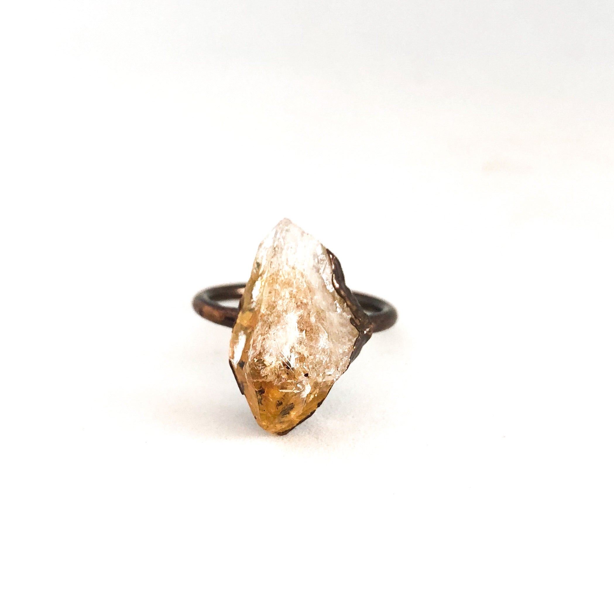 A beautiful Copper Gemstone Ring featuring citrine, amethyst, and rose quartz, showcasing its therapeutic properties and elegant design.