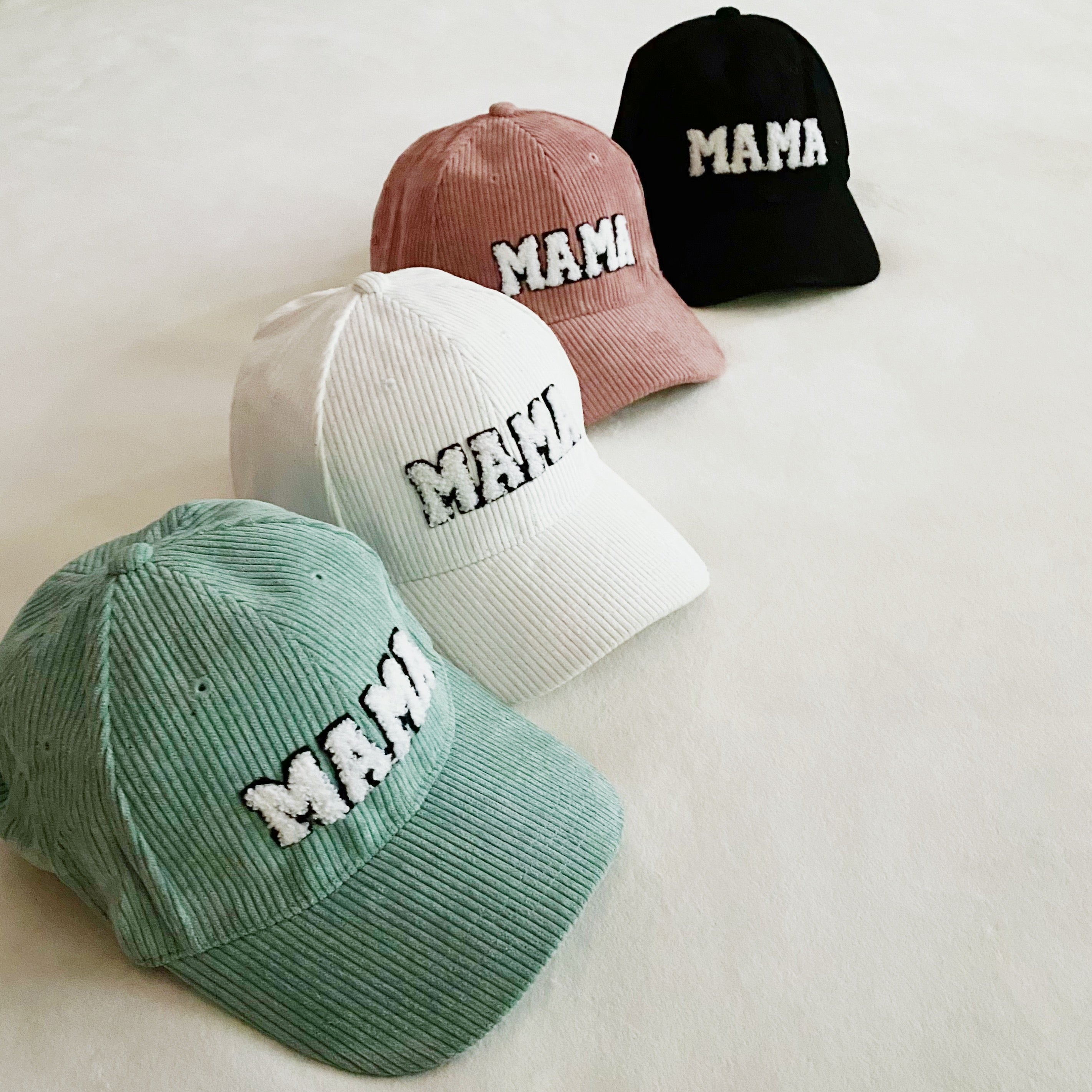 Corduroy Mama Ball Cap featuring fuzzy patch lettering and adjustable strap.