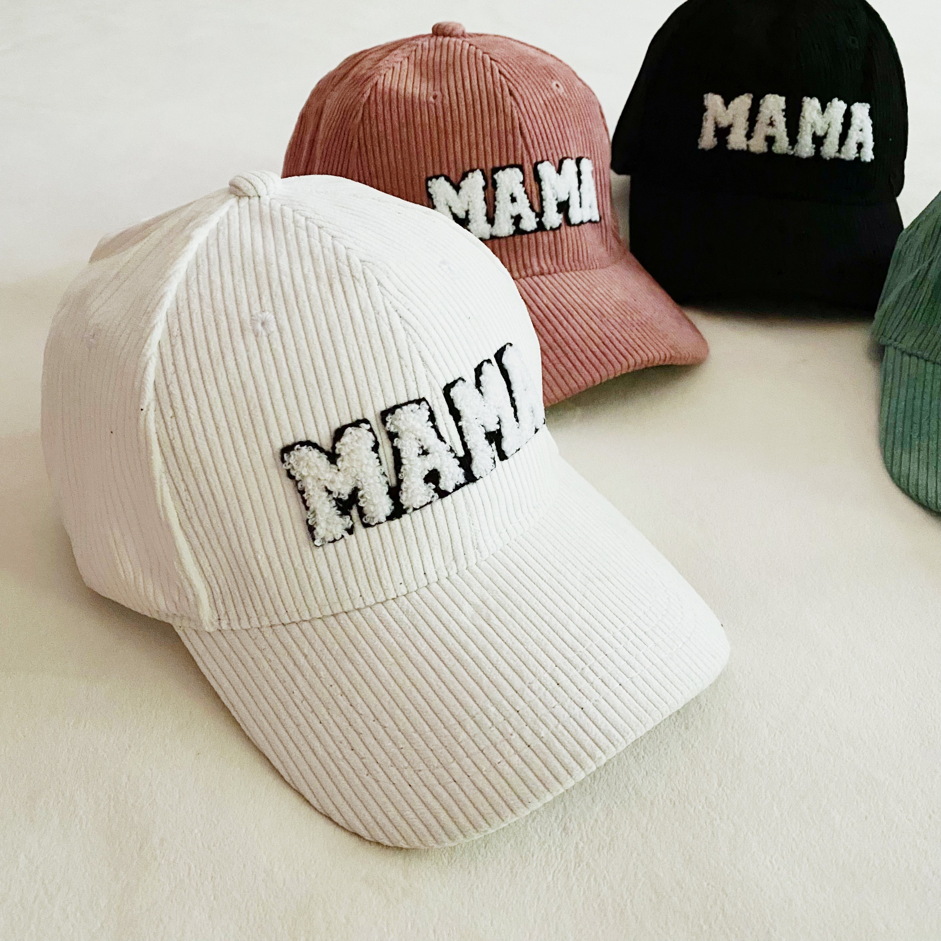 Corduroy Mama Ball Cap featuring fuzzy patch lettering and adjustable strap.