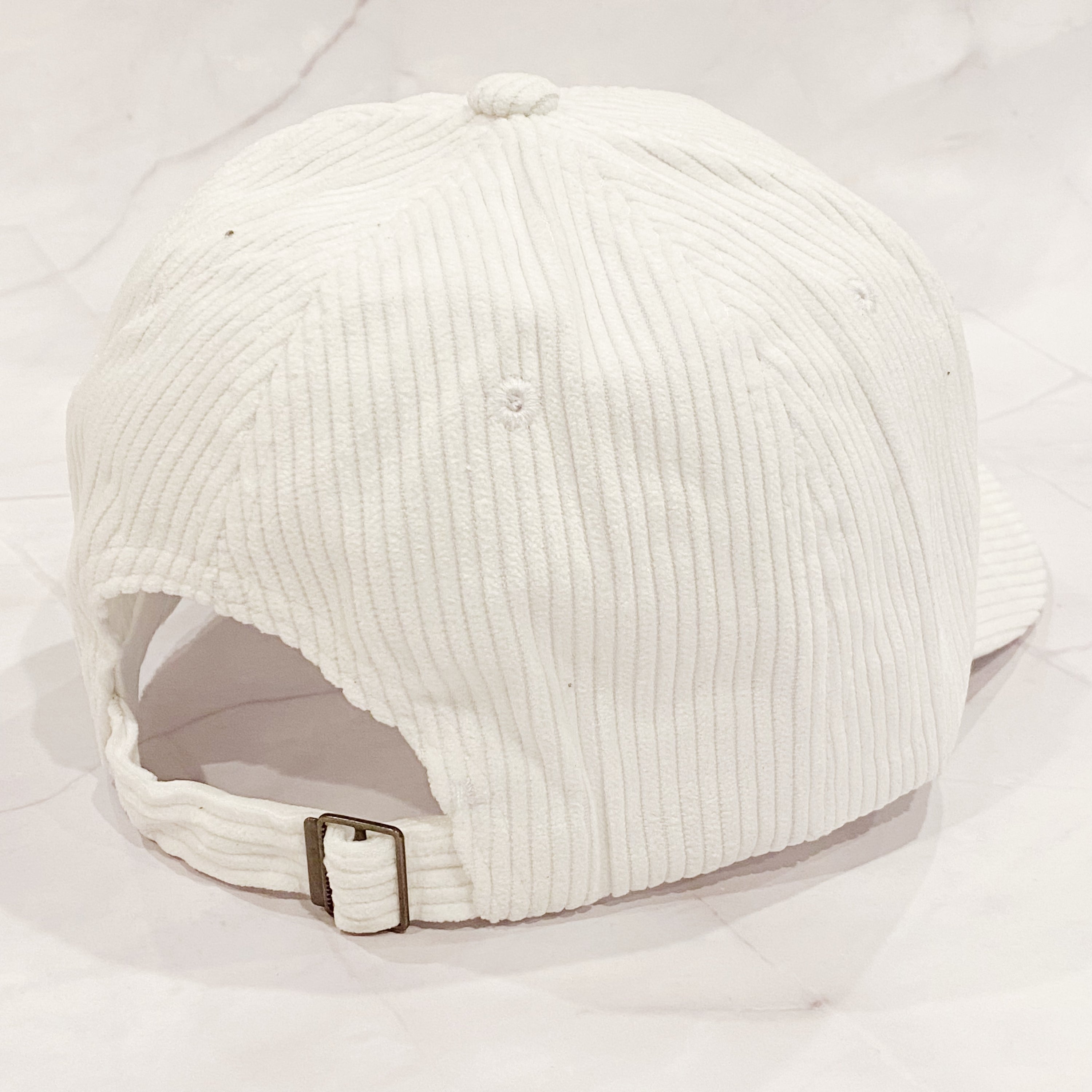 Corduroy Mama Ball Cap featuring fuzzy patch lettering and adjustable strap.