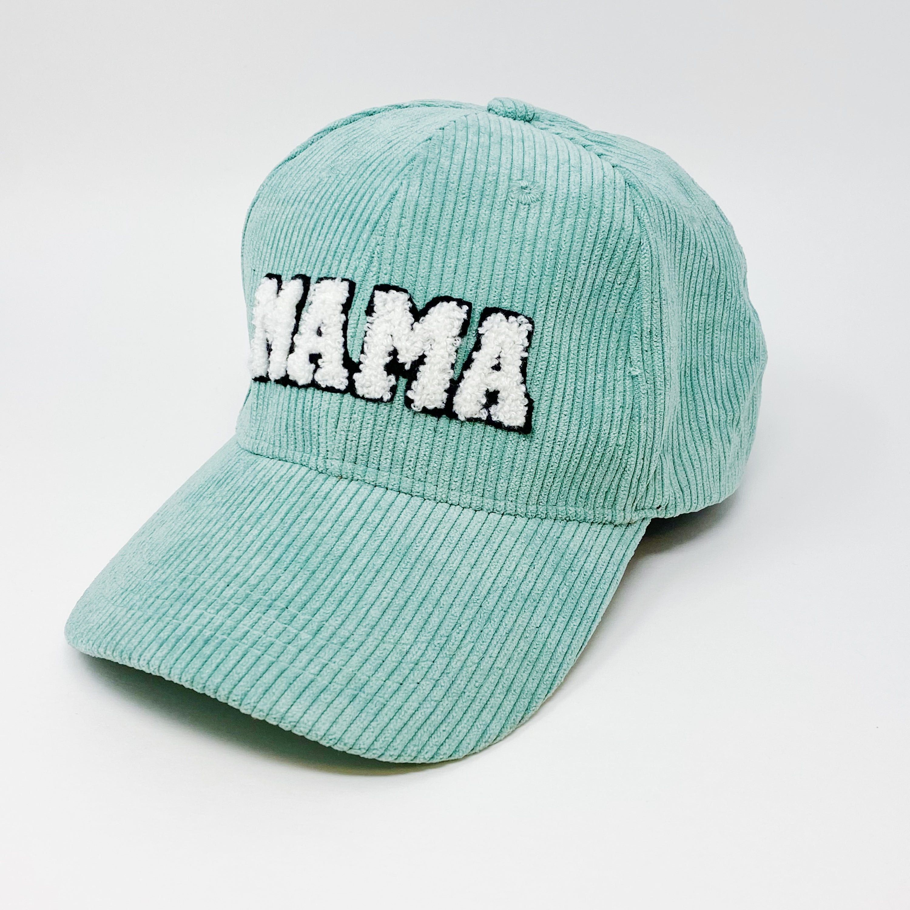 Corduroy Mama Ball Cap featuring fuzzy patch lettering and adjustable strap.