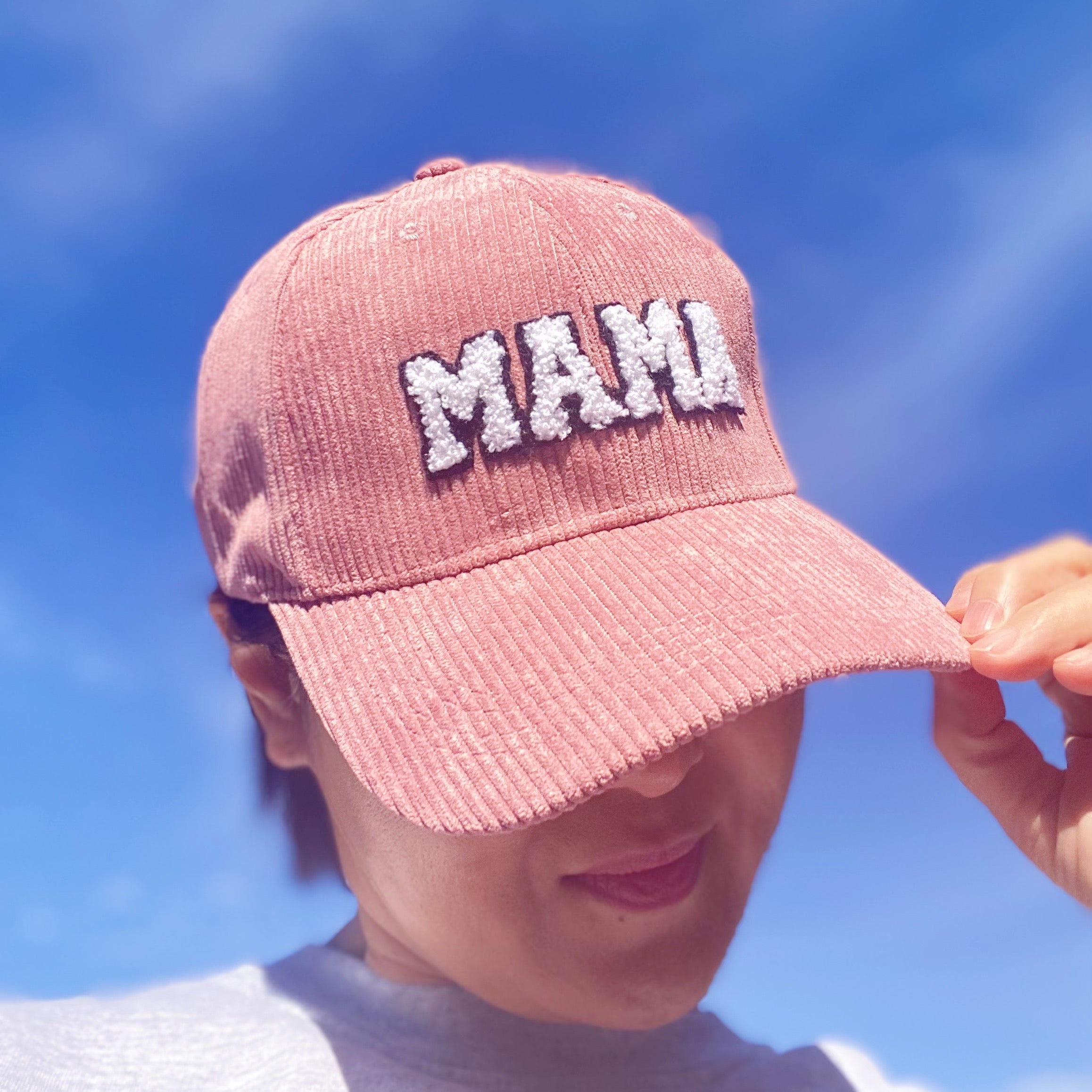 Corduroy Mama Ball Cap featuring fuzzy patch lettering and adjustable strap.