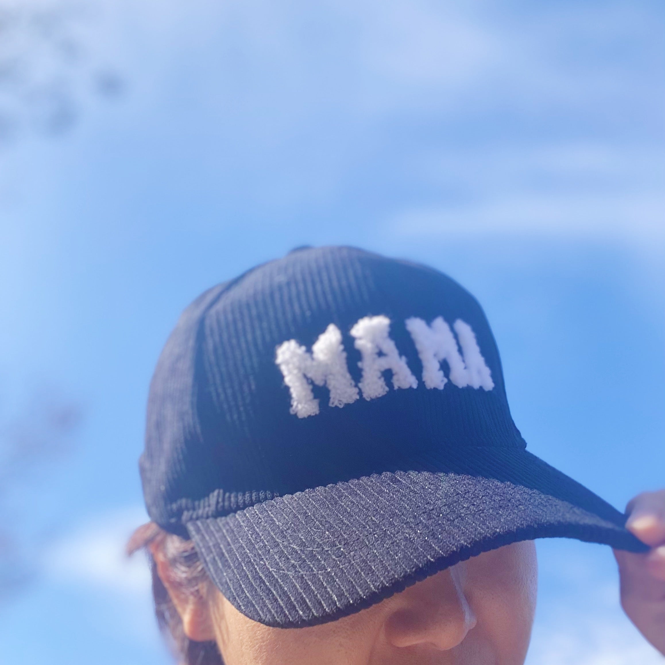 Corduroy Mama Ball Cap featuring fuzzy patch lettering and adjustable strap.