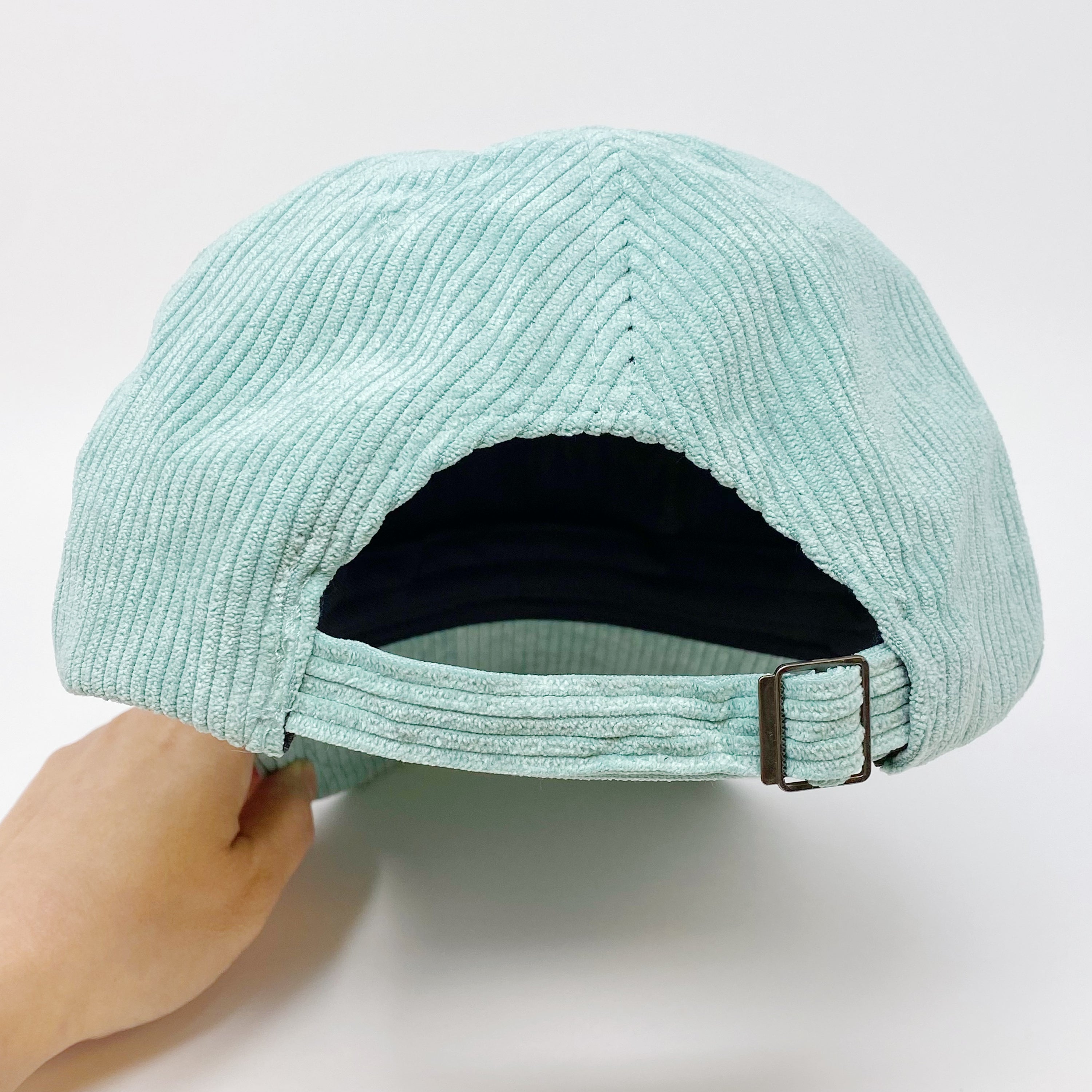 Corduroy Mama Ball Cap featuring fuzzy patch lettering and adjustable strap.