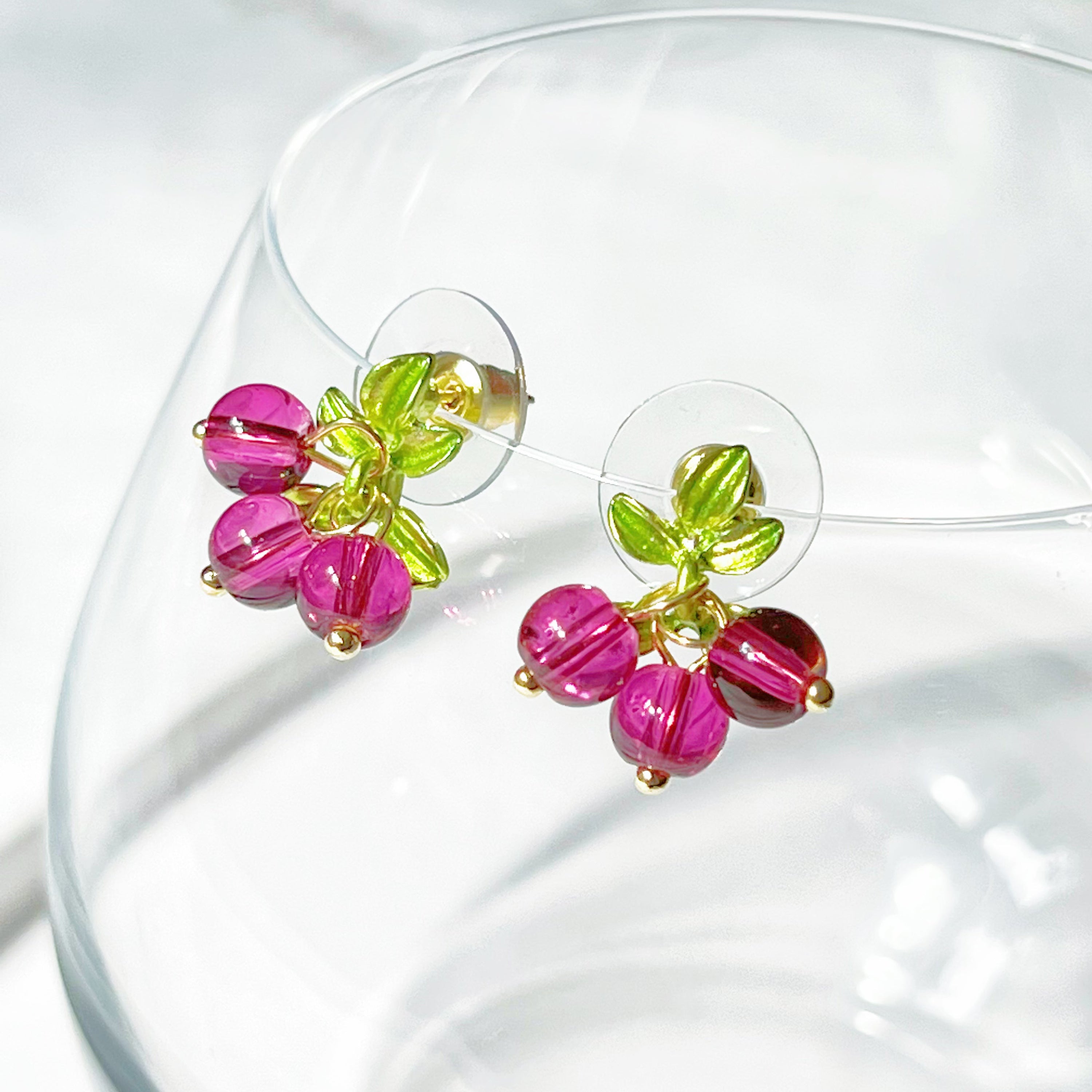 Cranberry with Leaves Plant Earrings featuring red beads and gold-plated bronze base, elegantly designed for nature lovers.