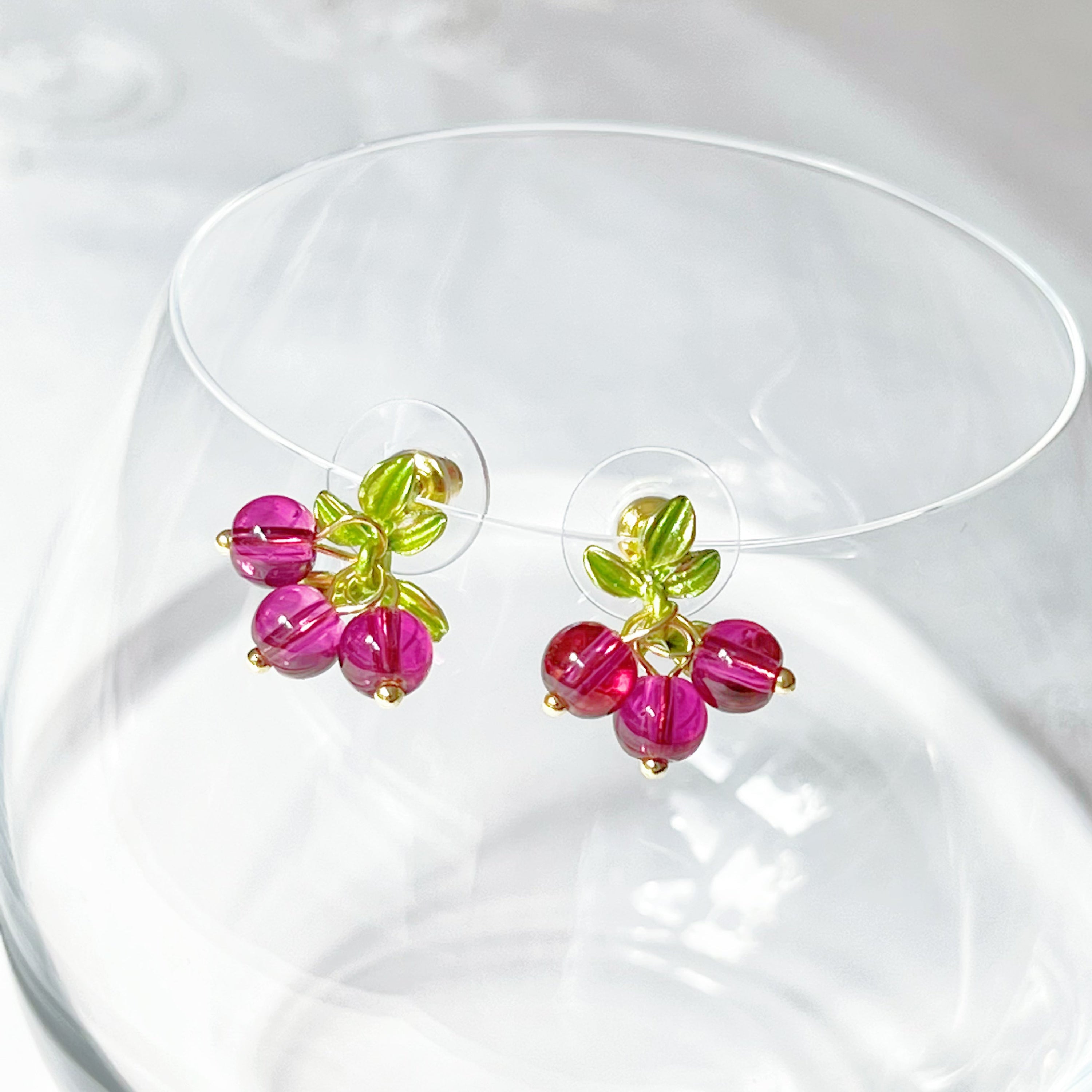 Cranberry with Leaves Plant Earrings featuring red beads and gold-plated bronze base, elegantly designed for nature lovers.