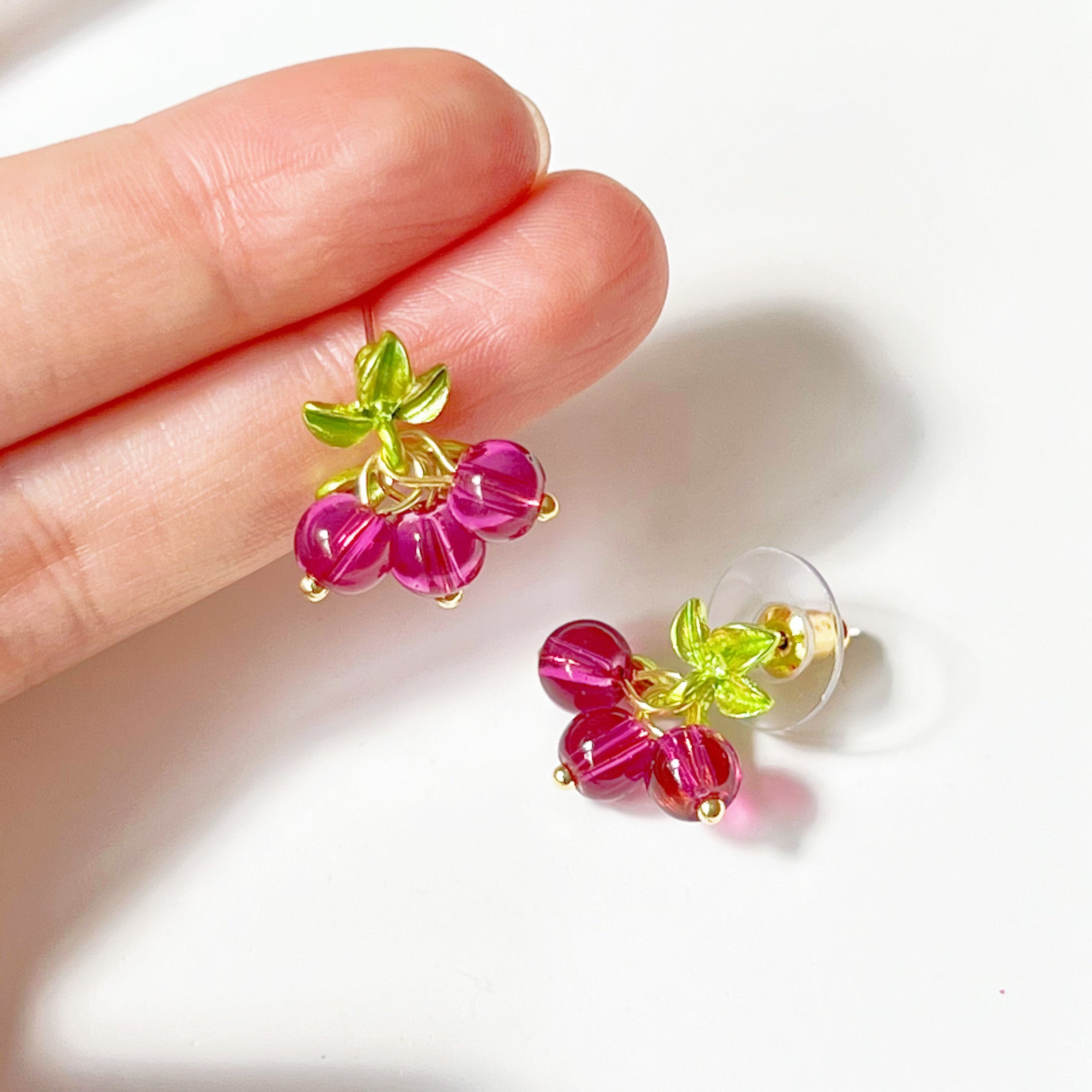 Cranberry with Leaves Plant Earrings featuring red beads and gold-plated bronze base, elegantly designed for nature lovers.