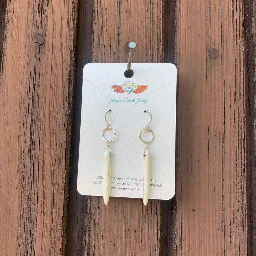 Elegant cream howlite drop earrings with rustic hammered circles, showcasing Southwestern style.