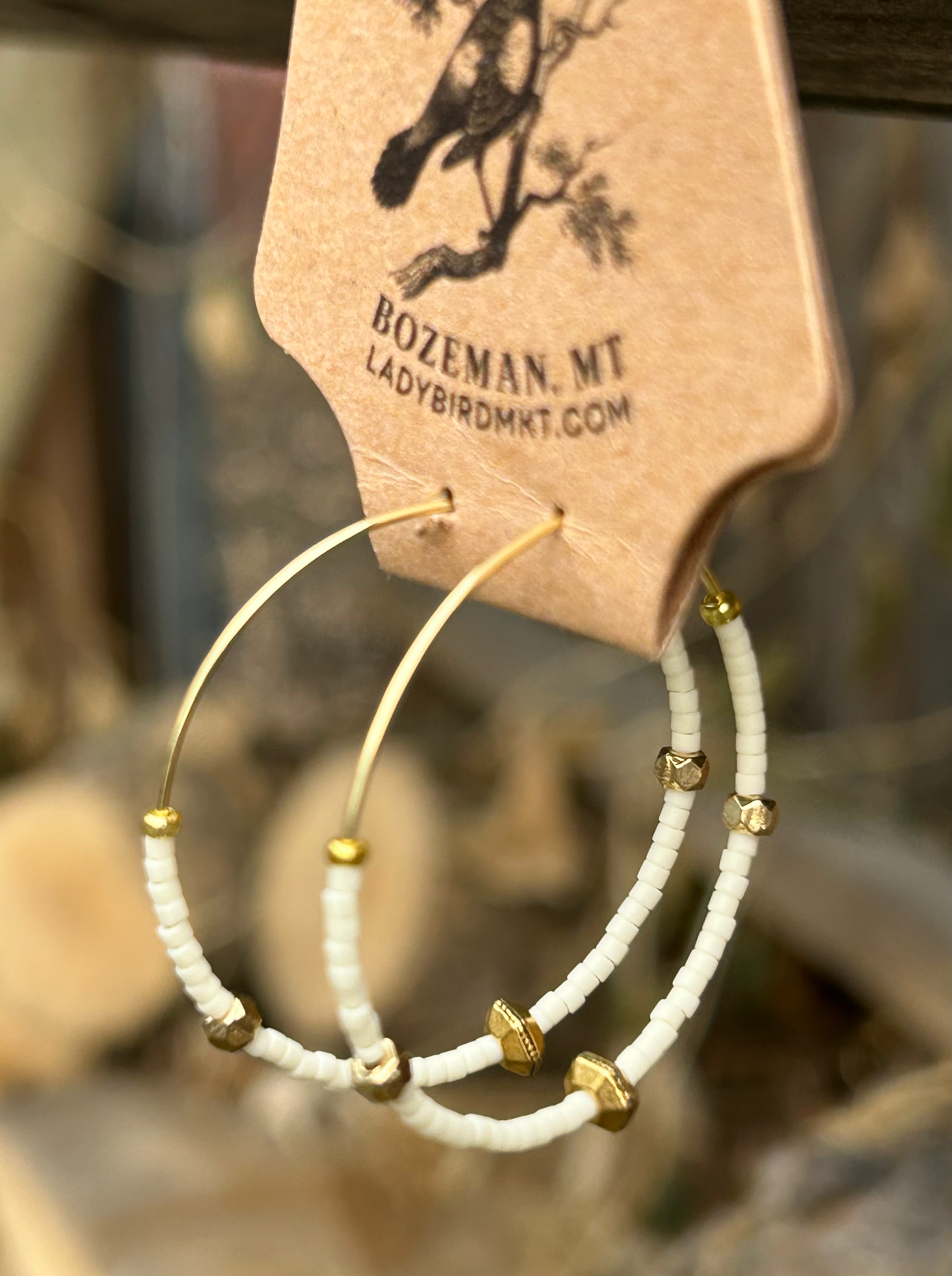 Creamy White & Bold Gold Beaded Hoops featuring gold-colored hoops and Czech glass seed beads, perfect for bohemian style.