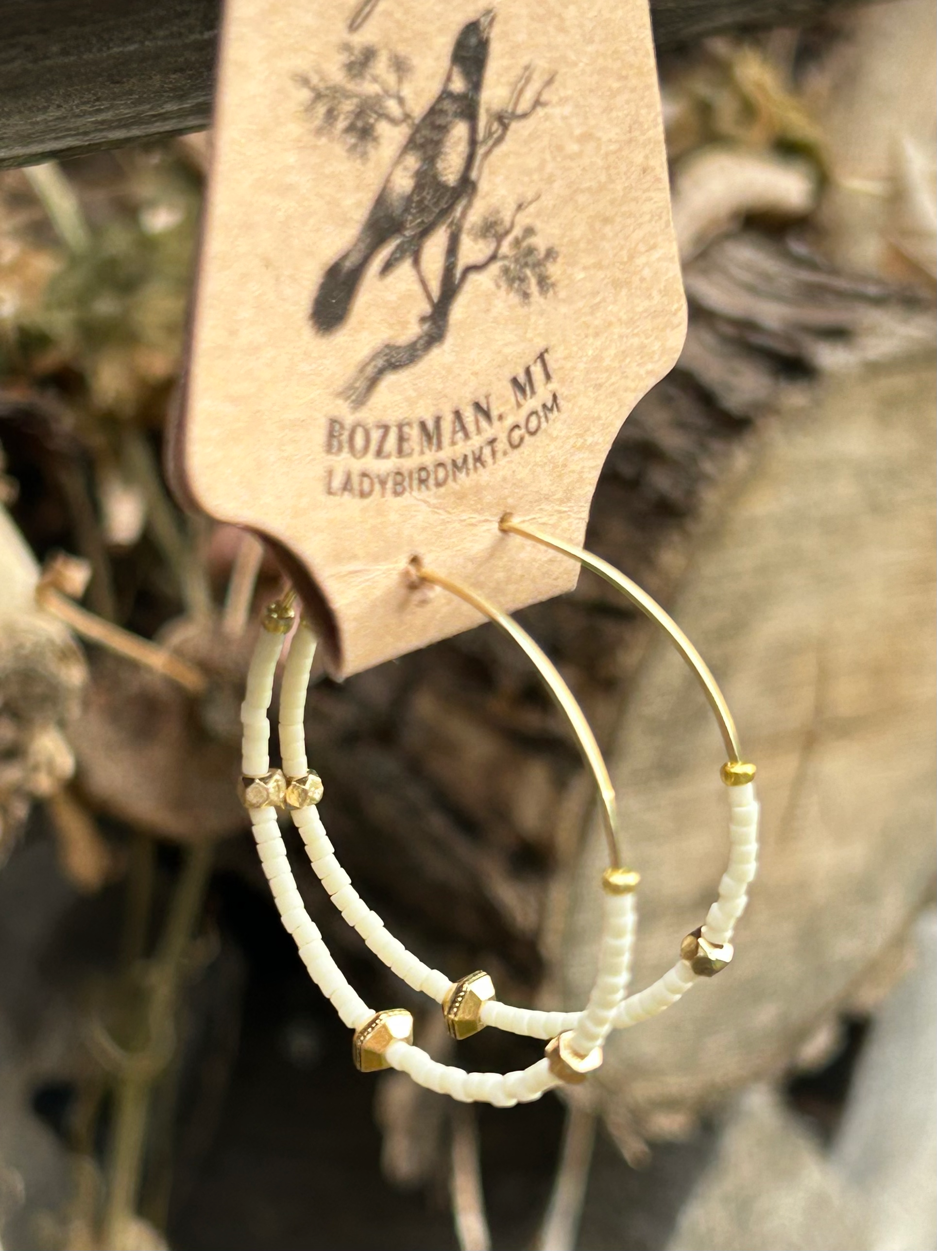 Creamy White & Bold Gold Beaded Hoops featuring gold-colored hoops and Czech glass seed beads, perfect for bohemian style.