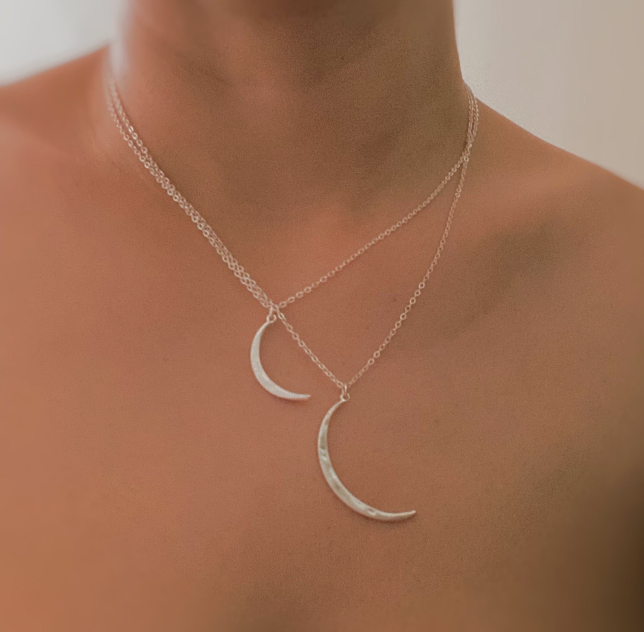 Crescent Duo Necklace Set of 2 featuring two crescent pendants in different sizes on adjustable chains.