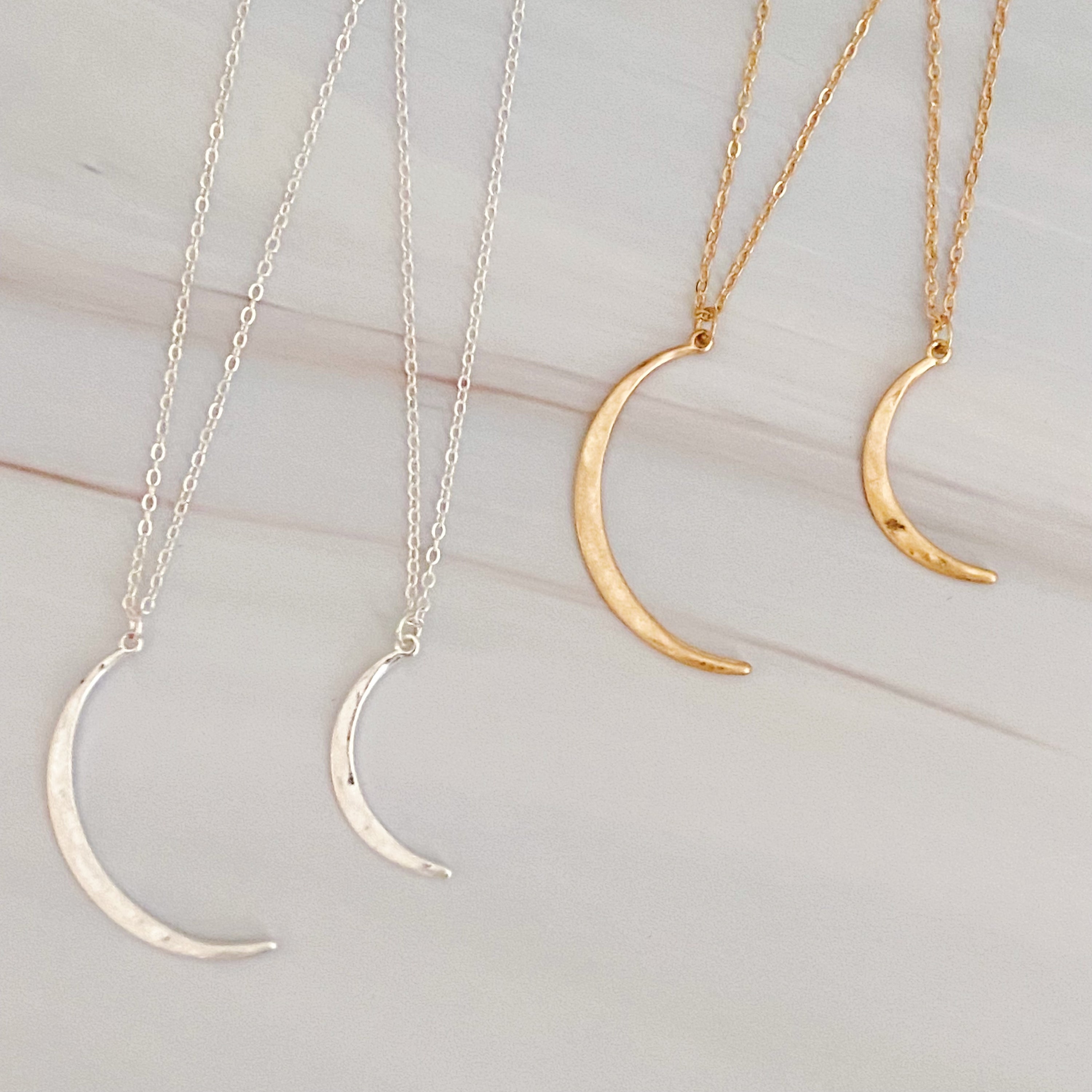 Crescent Duo Necklace Set of 2 featuring two crescent pendants in different sizes on adjustable chains.